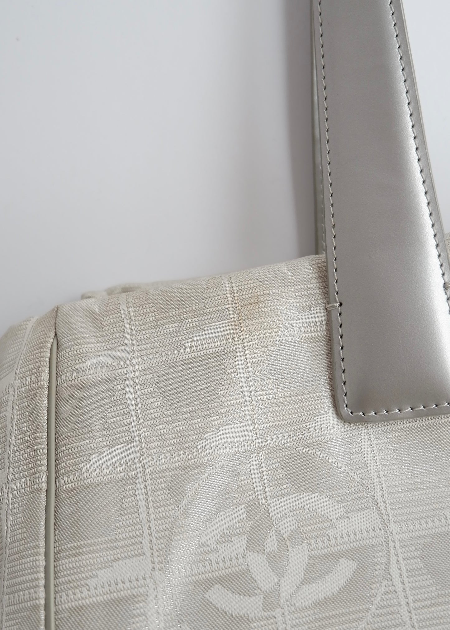 Authentic Preowned Chanel Silver Canvas New Travel Line Tote Bag