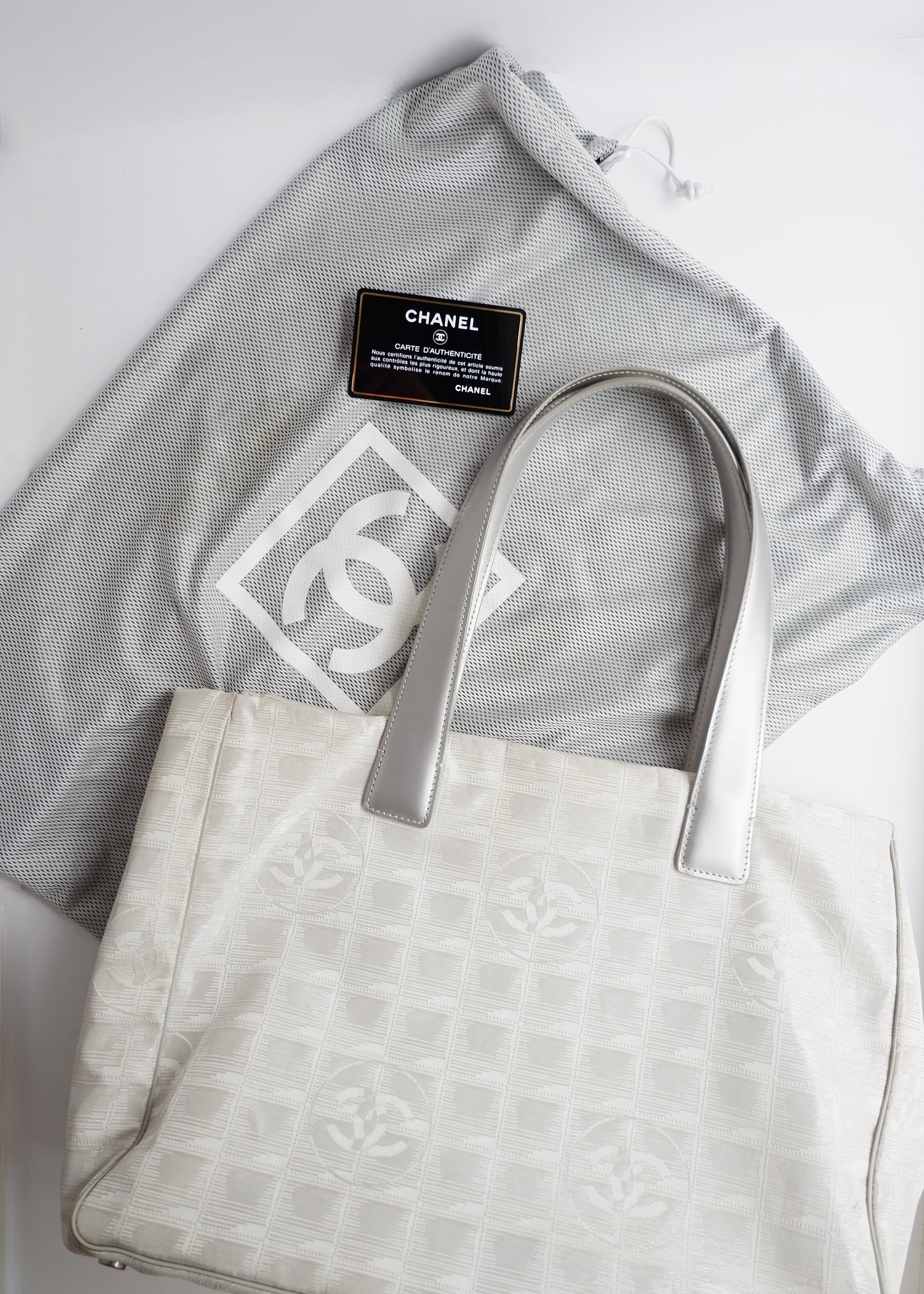 Authentic Preowned Chanel Silver Canvas New Travel Line Tote Bag