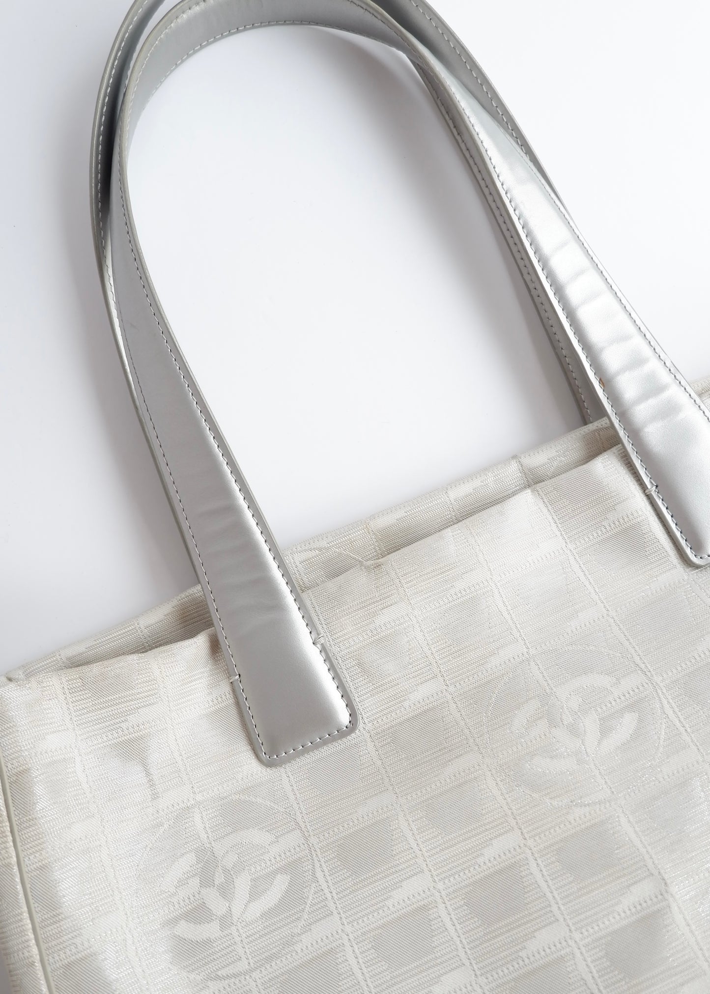 Authentic Preowned Chanel Silver Canvas New Travel Line Tote Bag