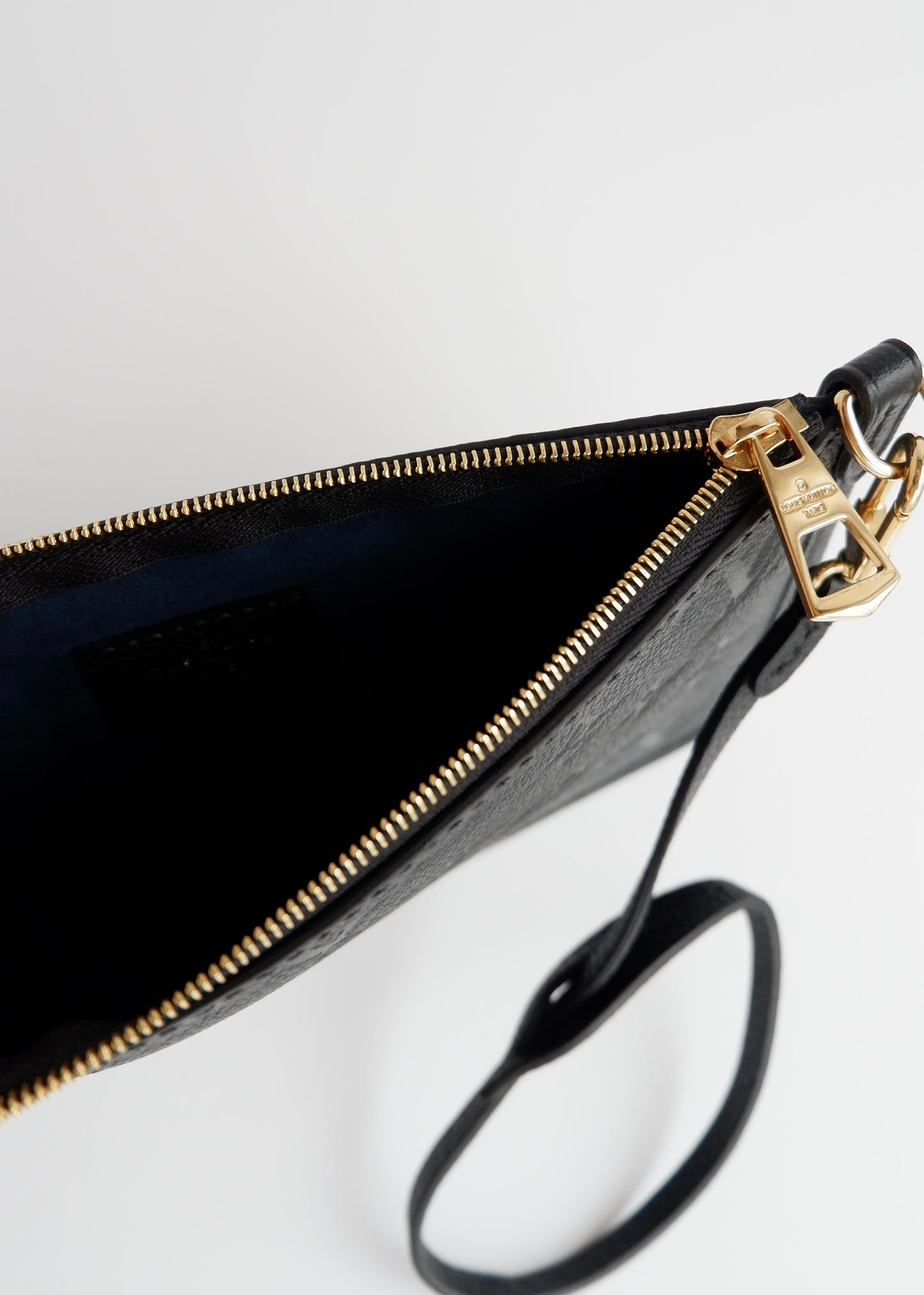 Authentic Preowned Louis Vuitton Black Empreinte Monogram Wrislet Pouch (For Neverfull)