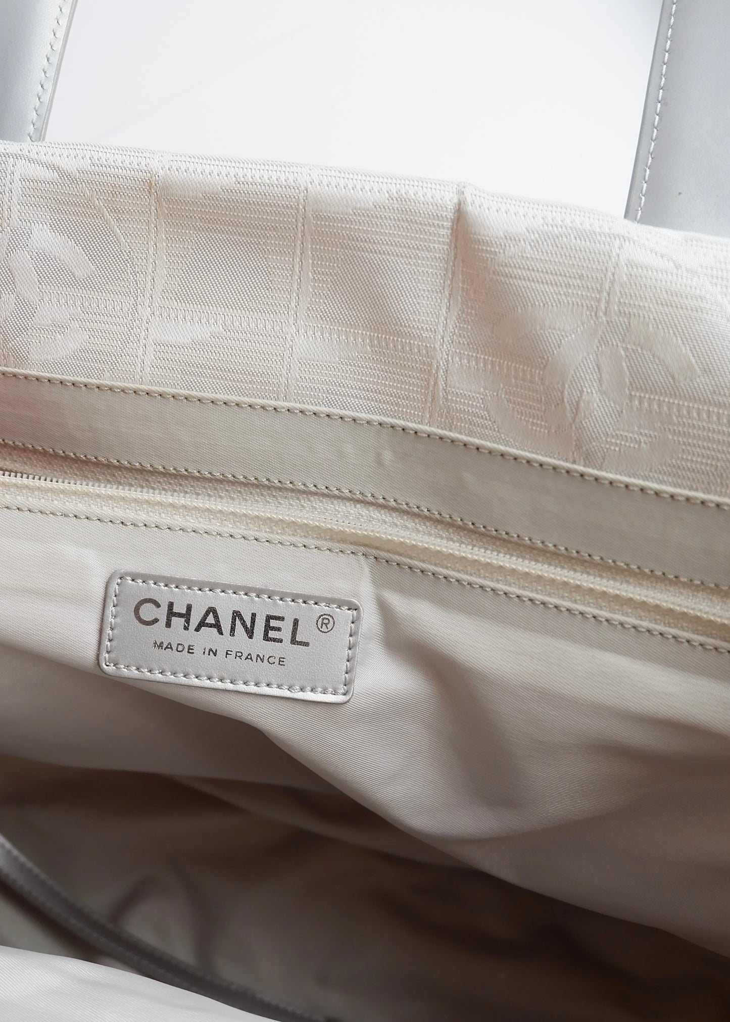 Authentic Preowned Chanel Silver Canvas New Travel Line Tote Bag