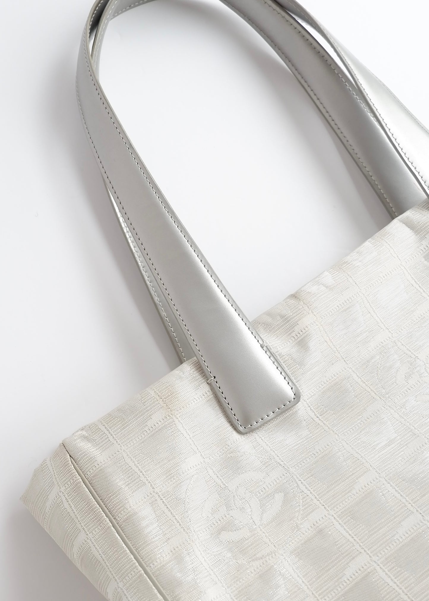 Authentic Preowned Chanel Silver Canvas New Travel Line Tote Bag