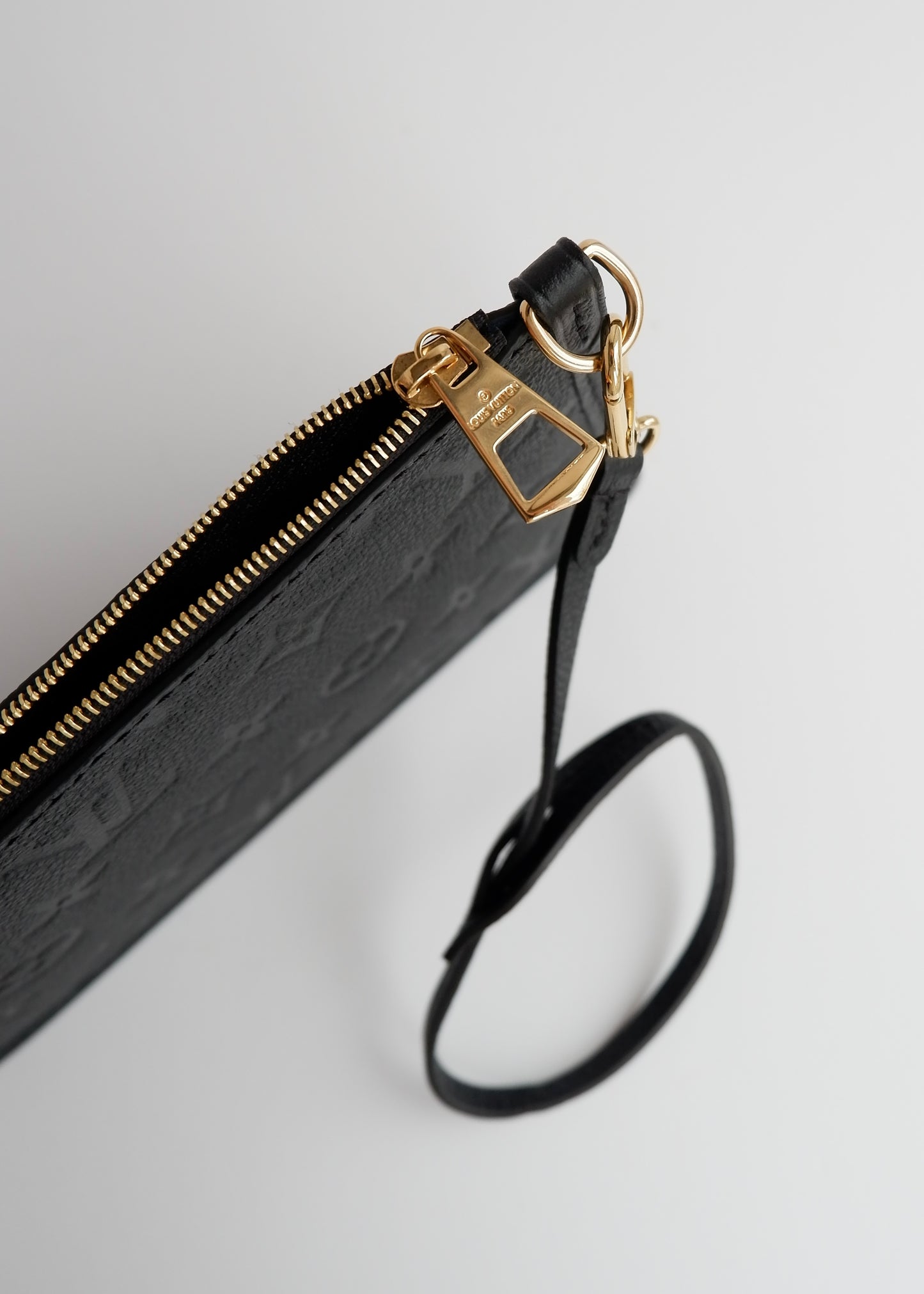 Authentic Preowned Louis Vuitton Black Empreinte Monogram Wrislet Pouch (For Neverfull)