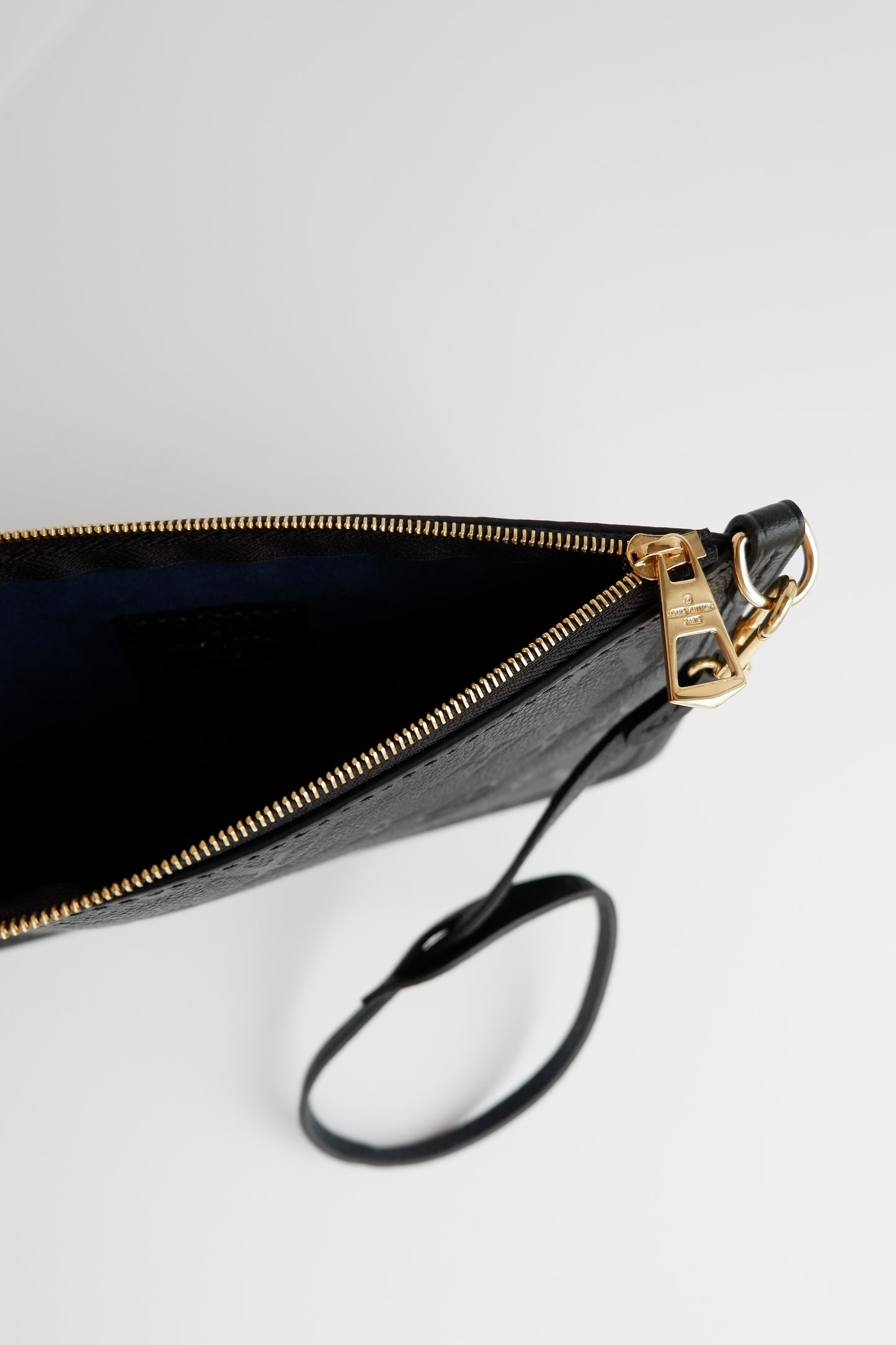Authentic Preowned Louis Vuitton Black Empreinte Monogram Wrislet Pouch (For Neverfull)