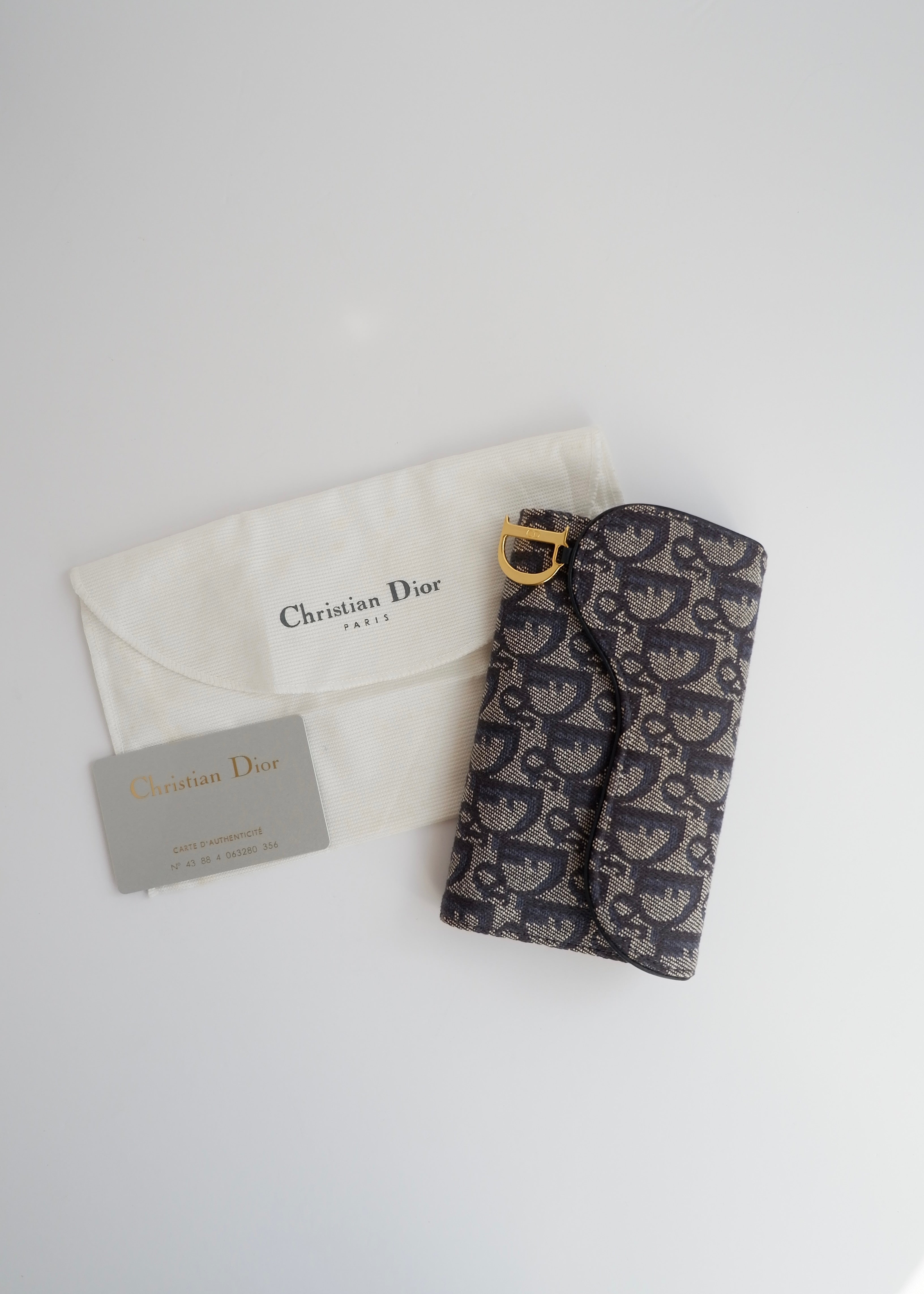 Portefeuille Dior authentique d'occasion en toile trotteur bleu marine