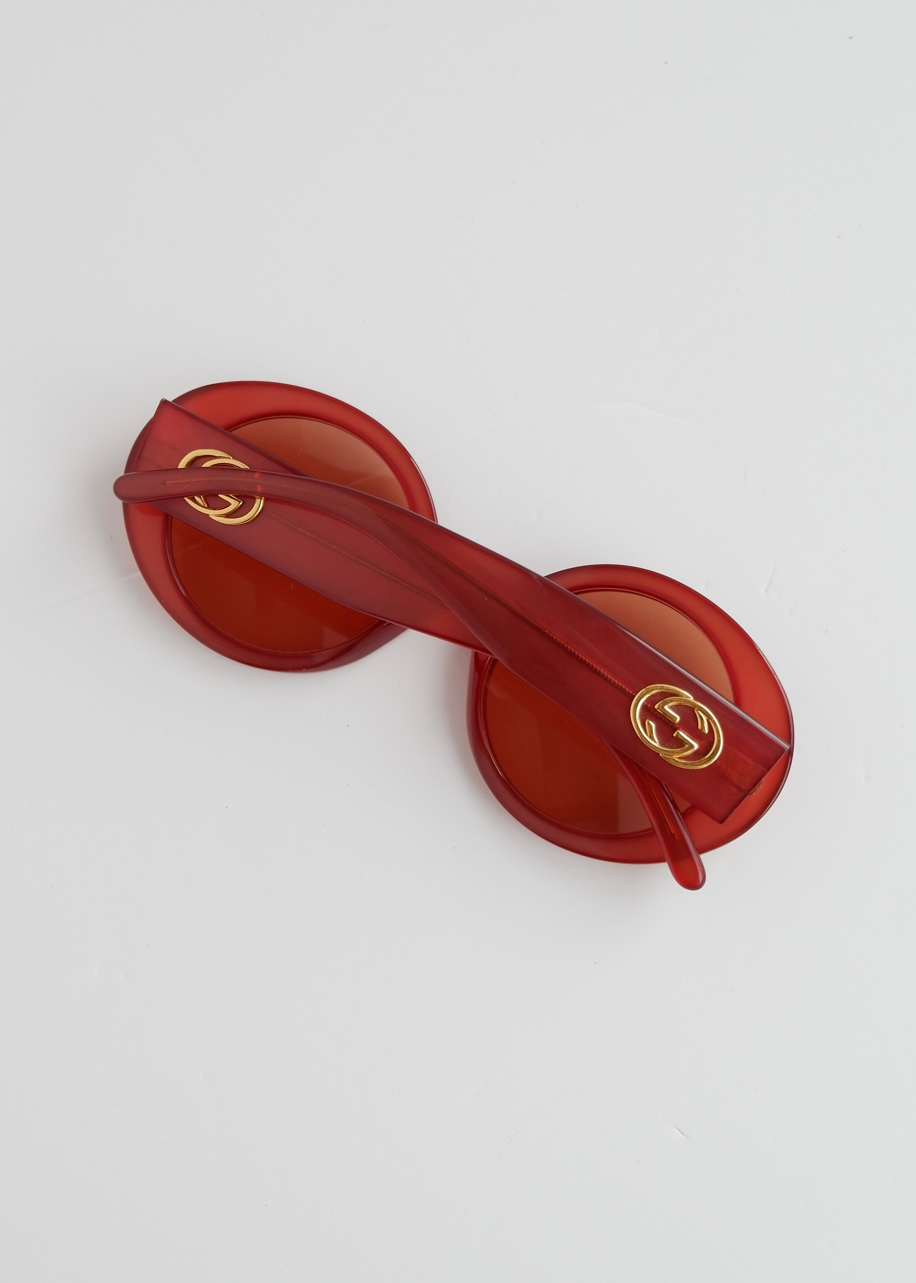 Authentiques lunettes de soleil Gucci rouges à monture ronde d'occasion