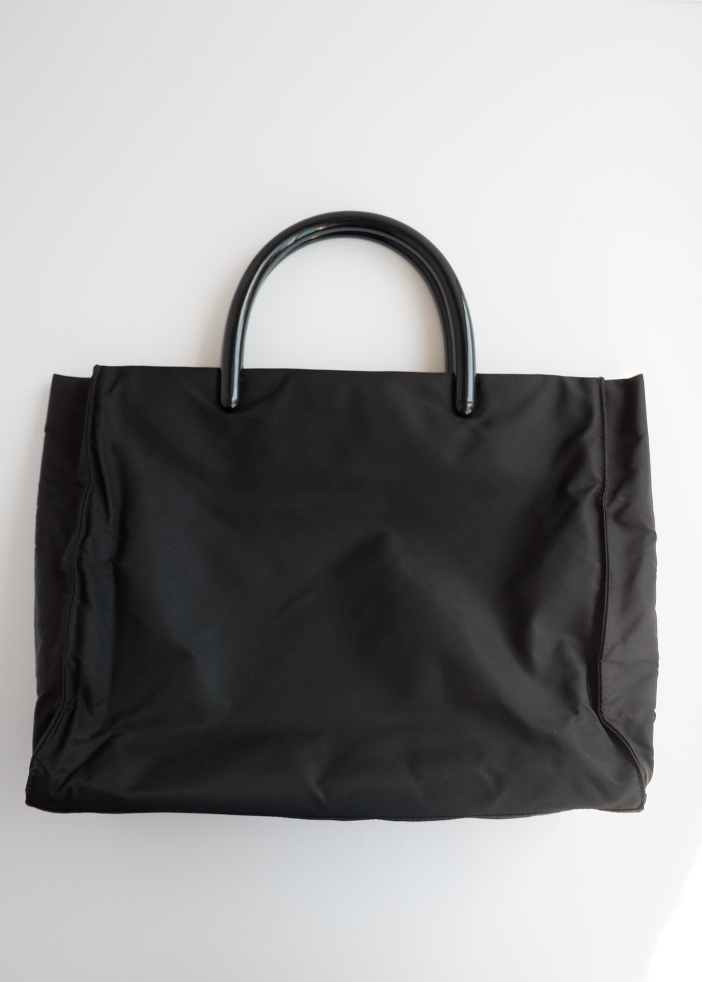 Sac à main Prada d'occasion authentique en nylon noir avec anse en acétate