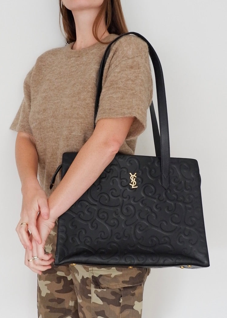 Preowned Vintage YSL Black Leather Embossed Printed Tote Bag