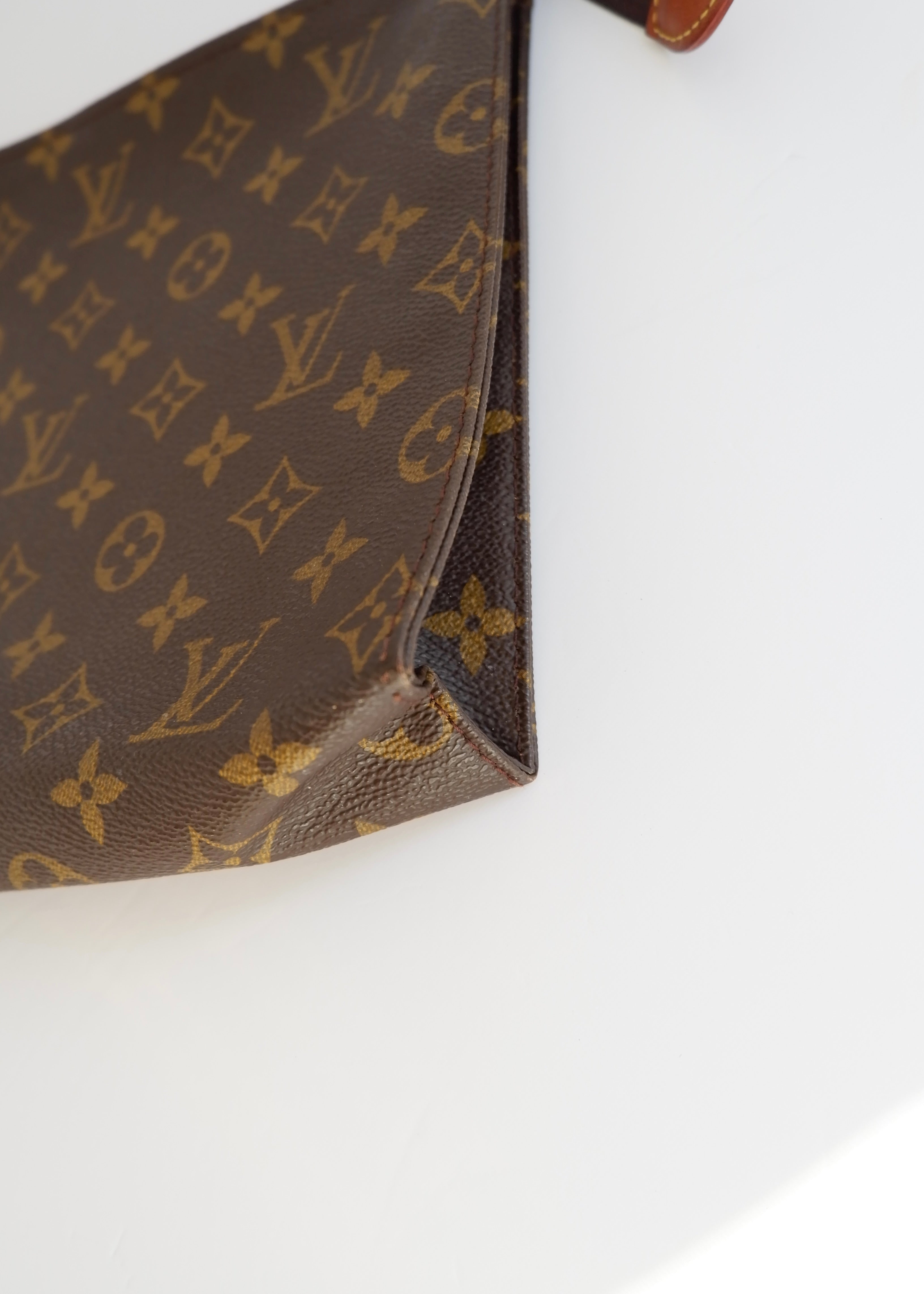 Authentique trousse de toilette monogramme Louis Vuitton d'occasion 26