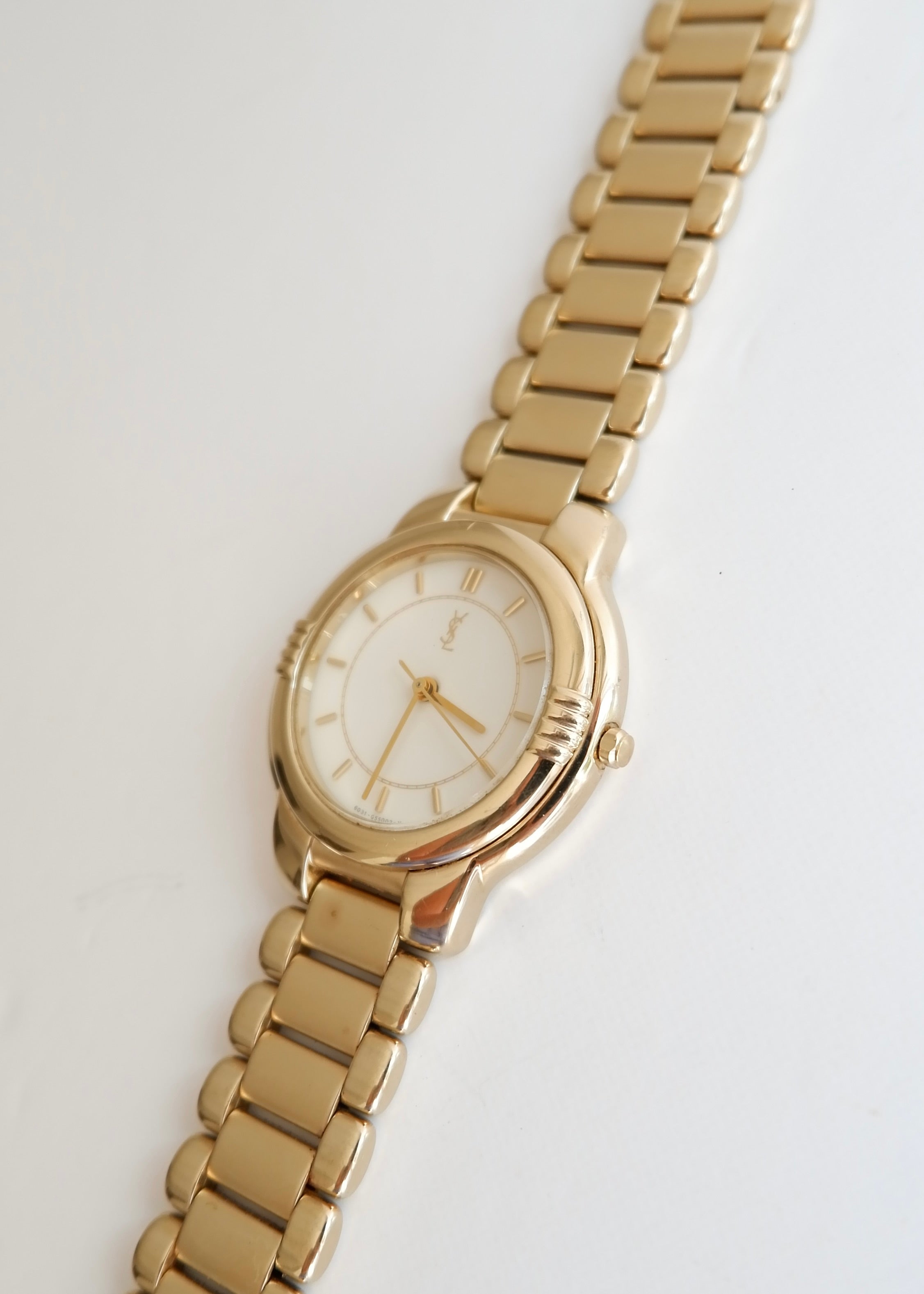Montre vintage YSL authentique d'occasion, ton doré
