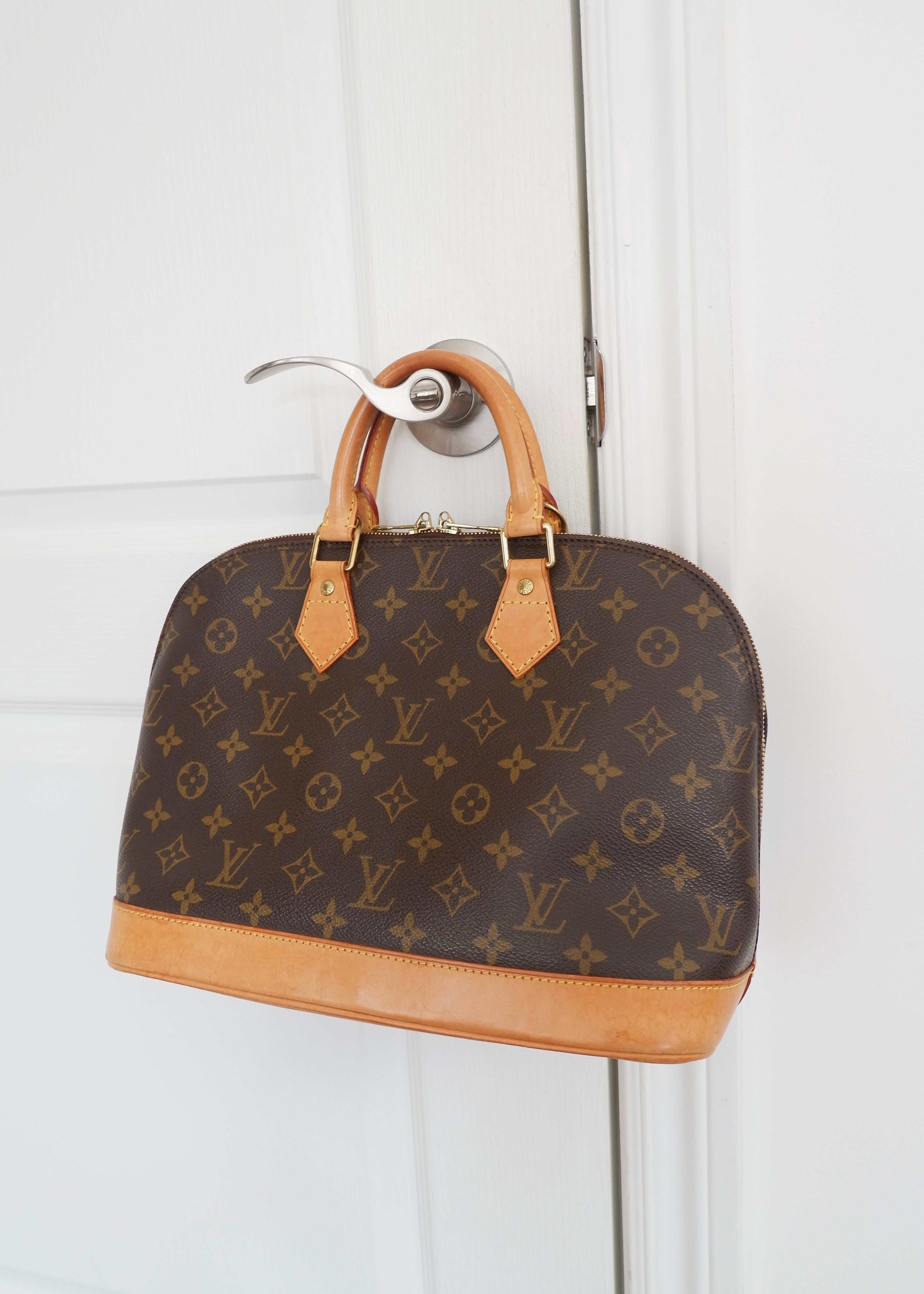 Sac à main Louis Vuitton Alma Monogram d'occasion authentique