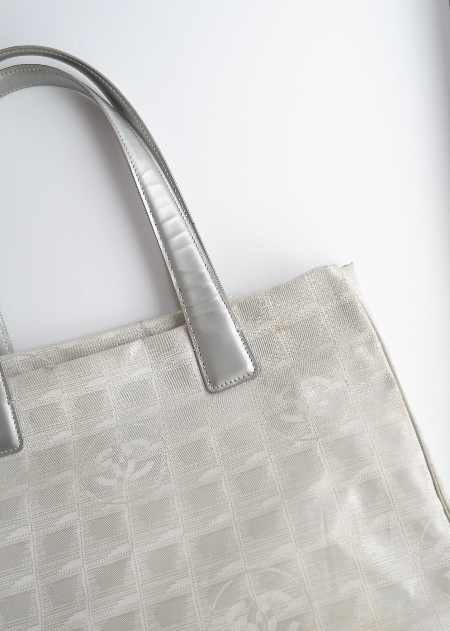 Authentic Preowned Chanel Silver Canvas New Travel Line Tote Bag