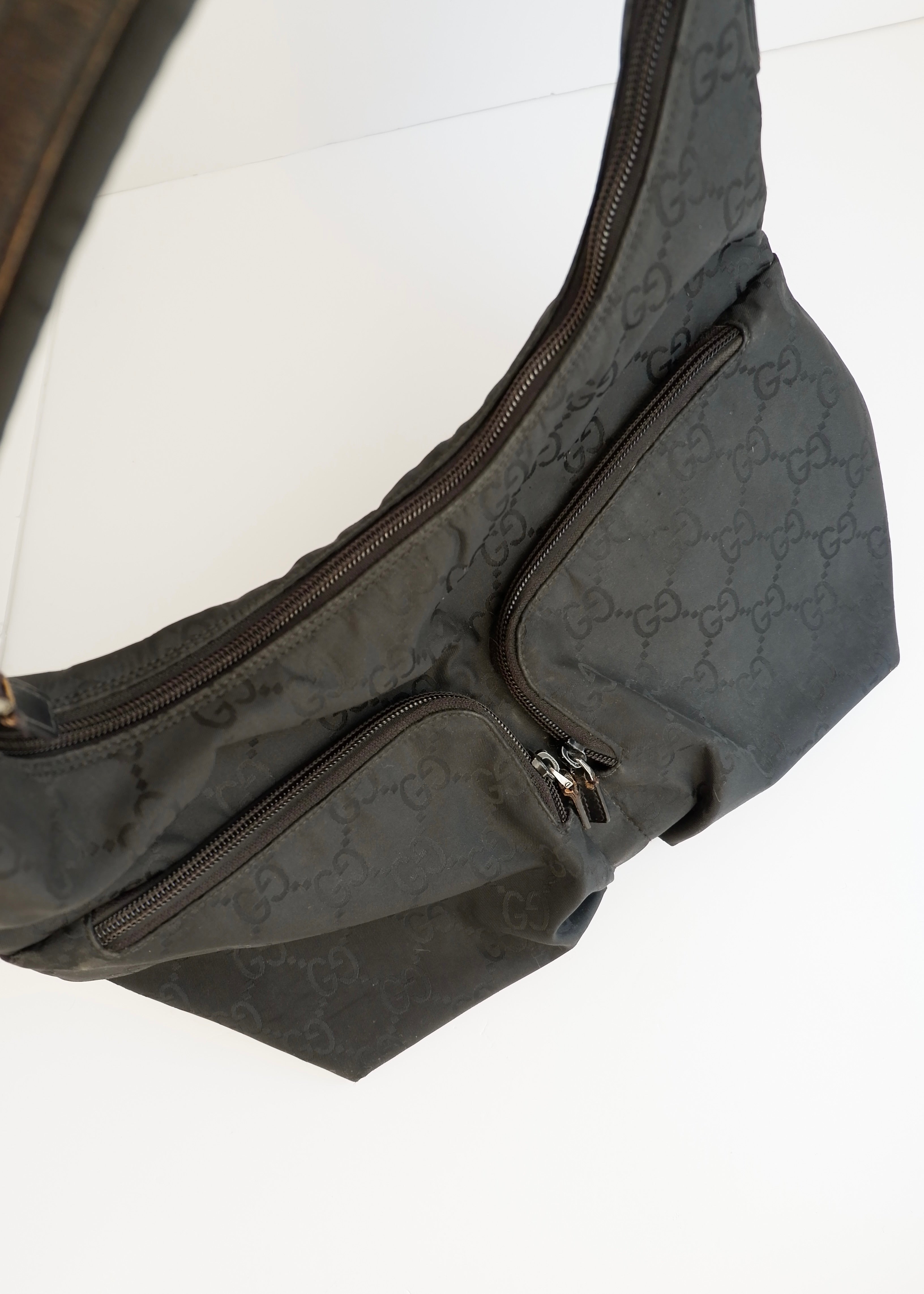 Authentique Sac à bandoulière Gucci en toile GG noire d'occasion