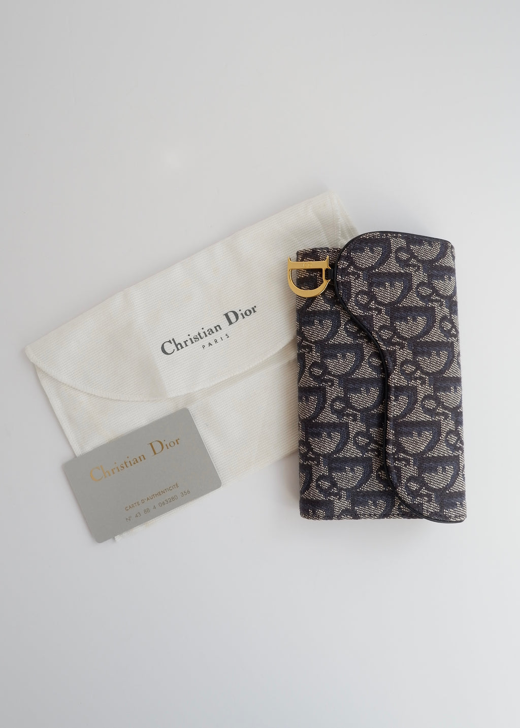 Portefeuille Dior authentique d'occasion en toile trotteur bleu marine