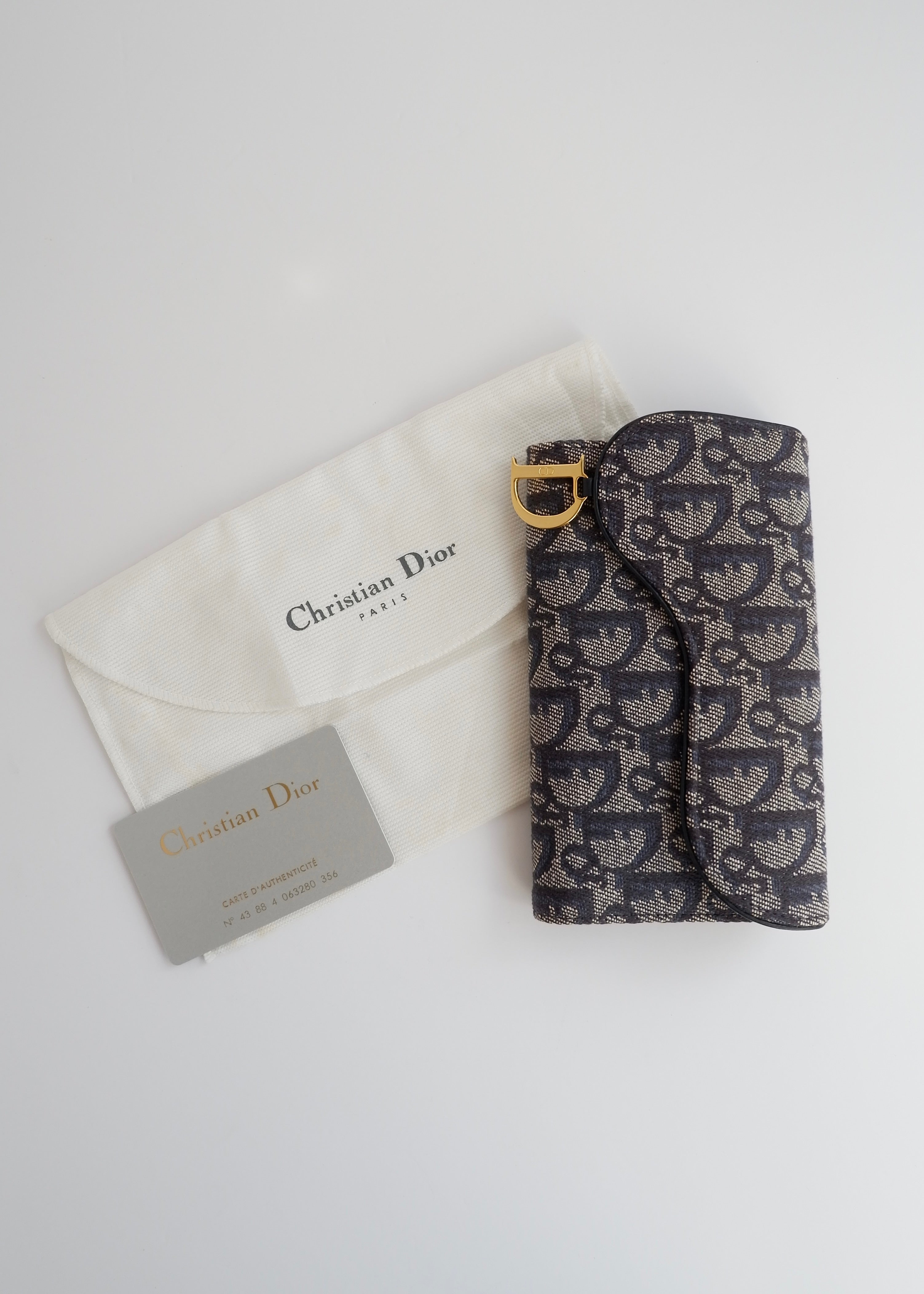 Portefeuille Dior authentique d'occasion en toile trotteur bleu marine