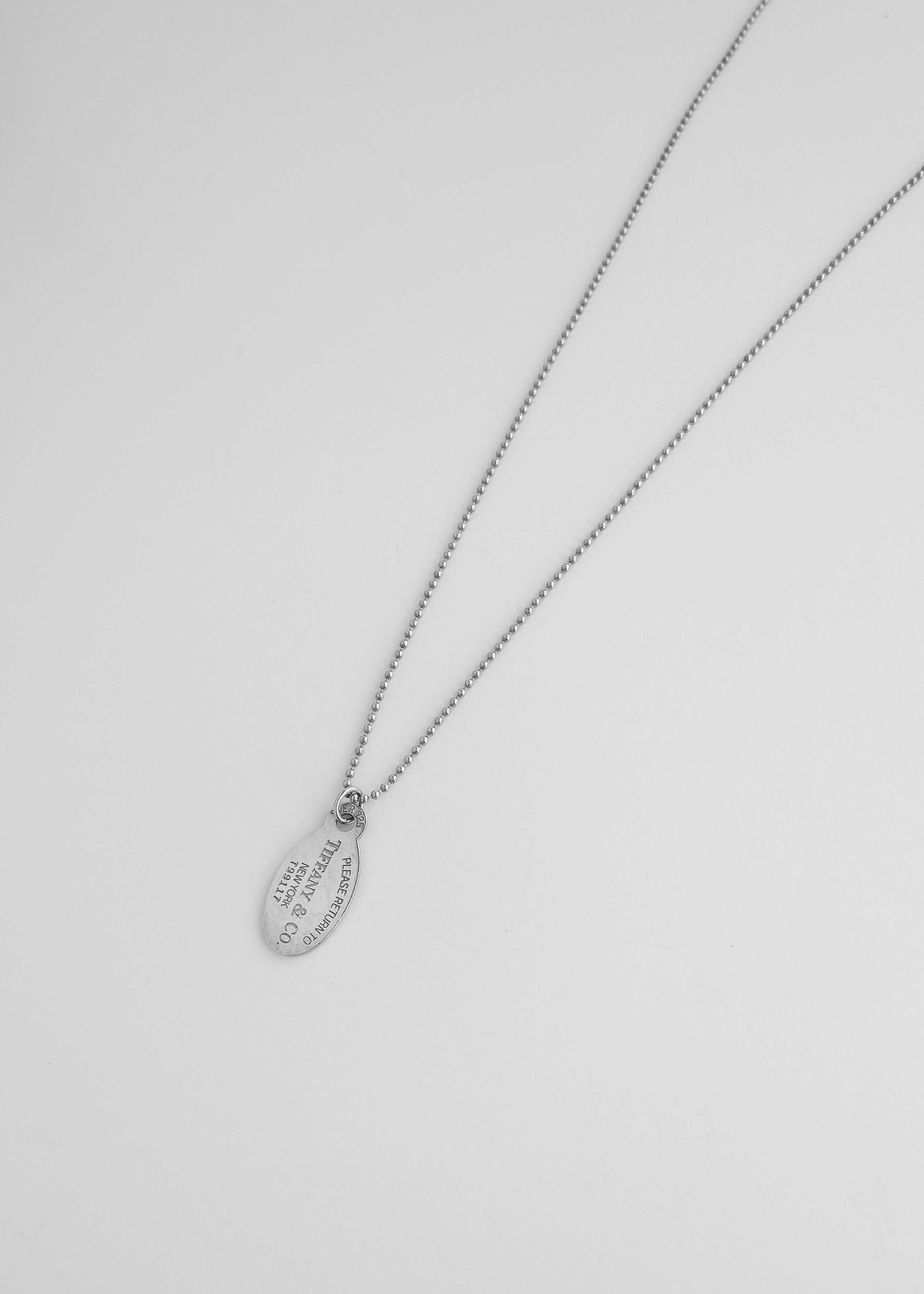 Authentique collier long chaîne avec pendentif plaque militaire Tiffany & Co. en argent d'occasion