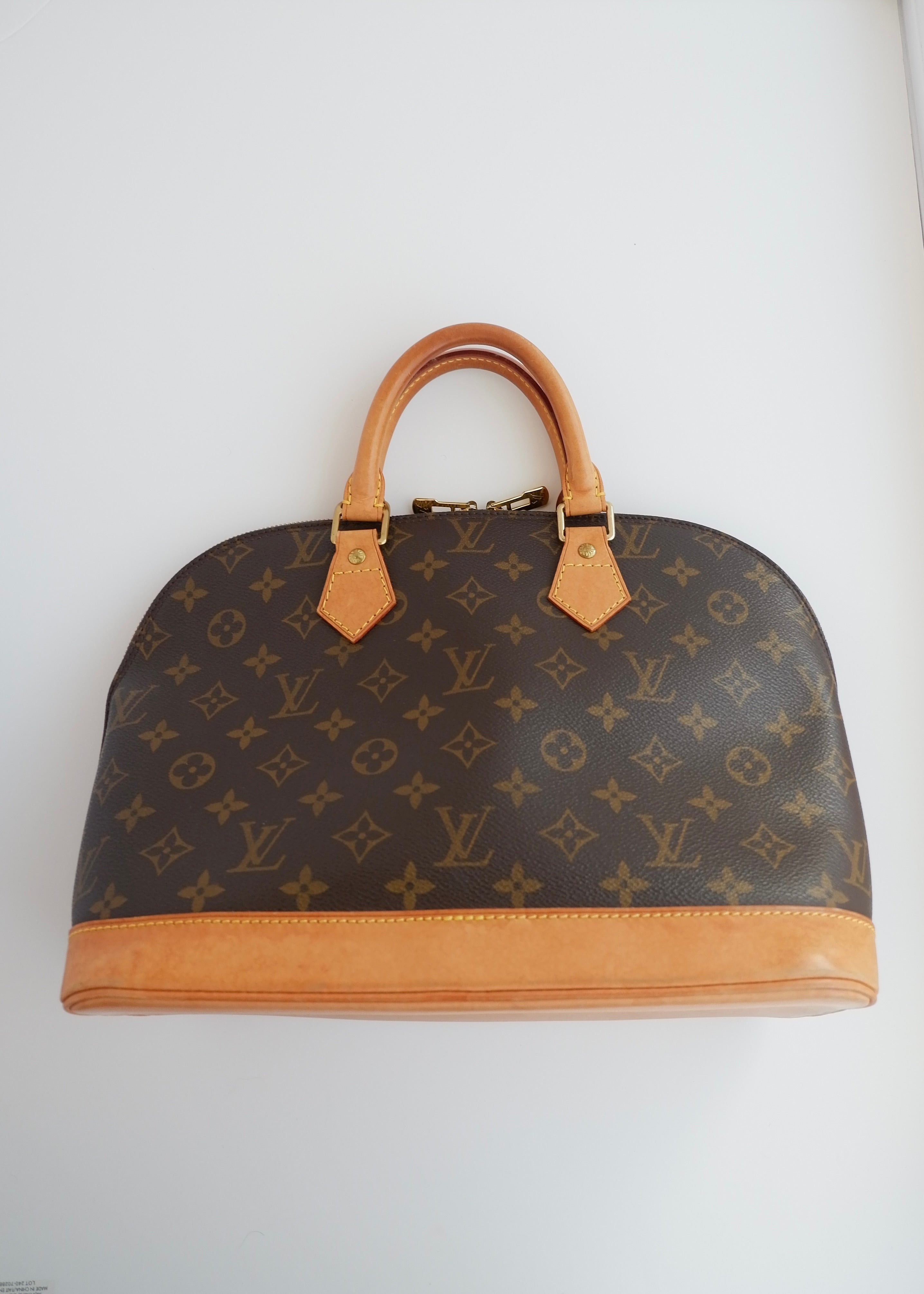 Sac à main Louis Vuitton Alma Monogram d'occasion authentique