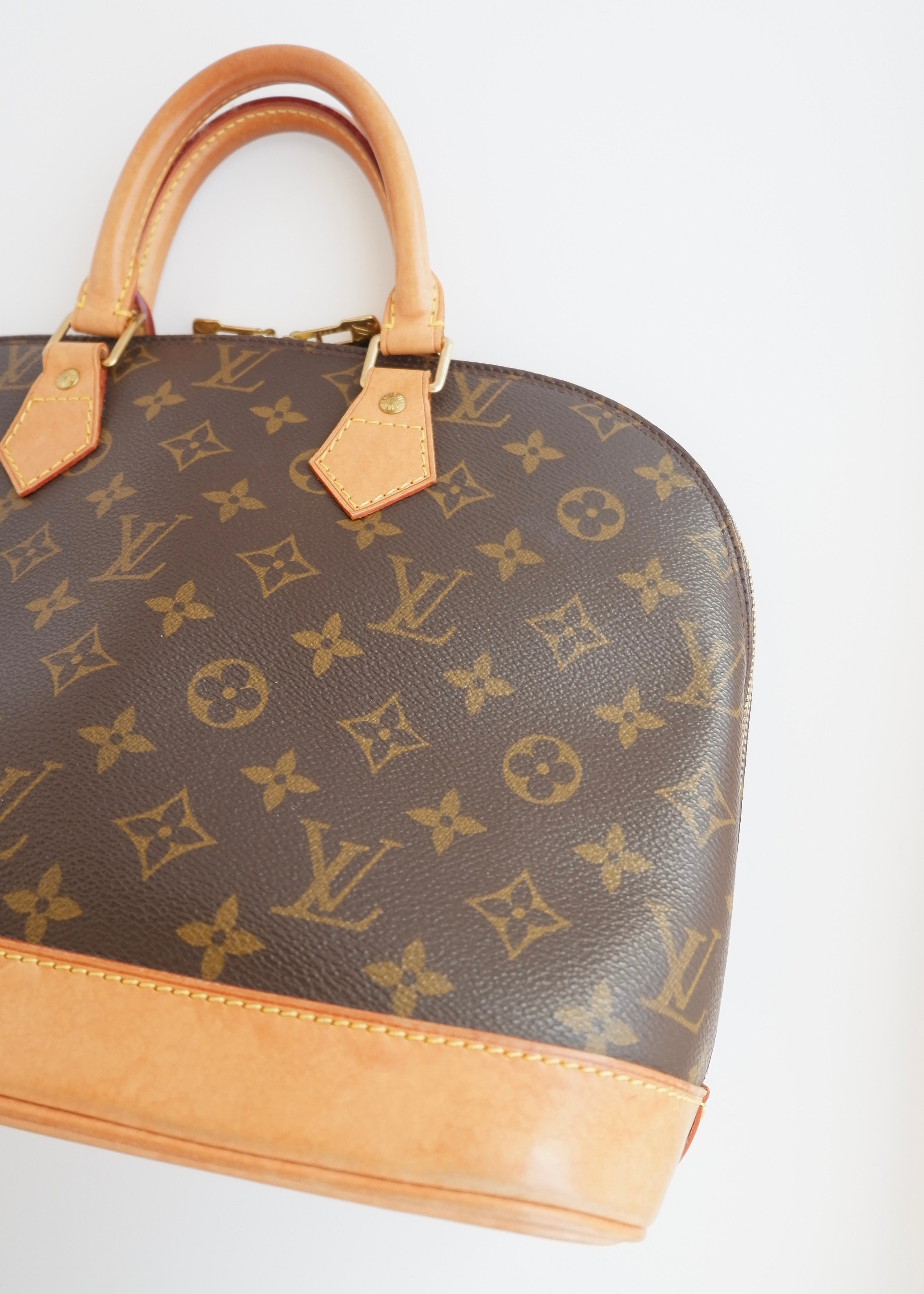 Sac à main Louis Vuitton Alma Monogram d'occasion authentique