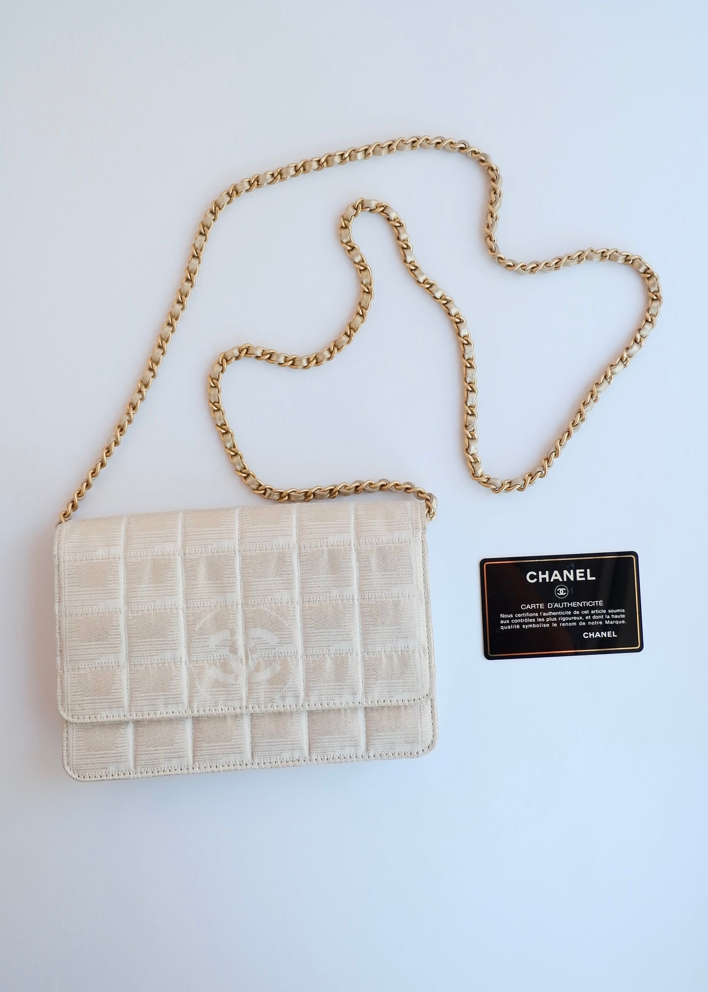 Authentic Preowned Chanel Gold Canvas New Travel Line WOC Bag