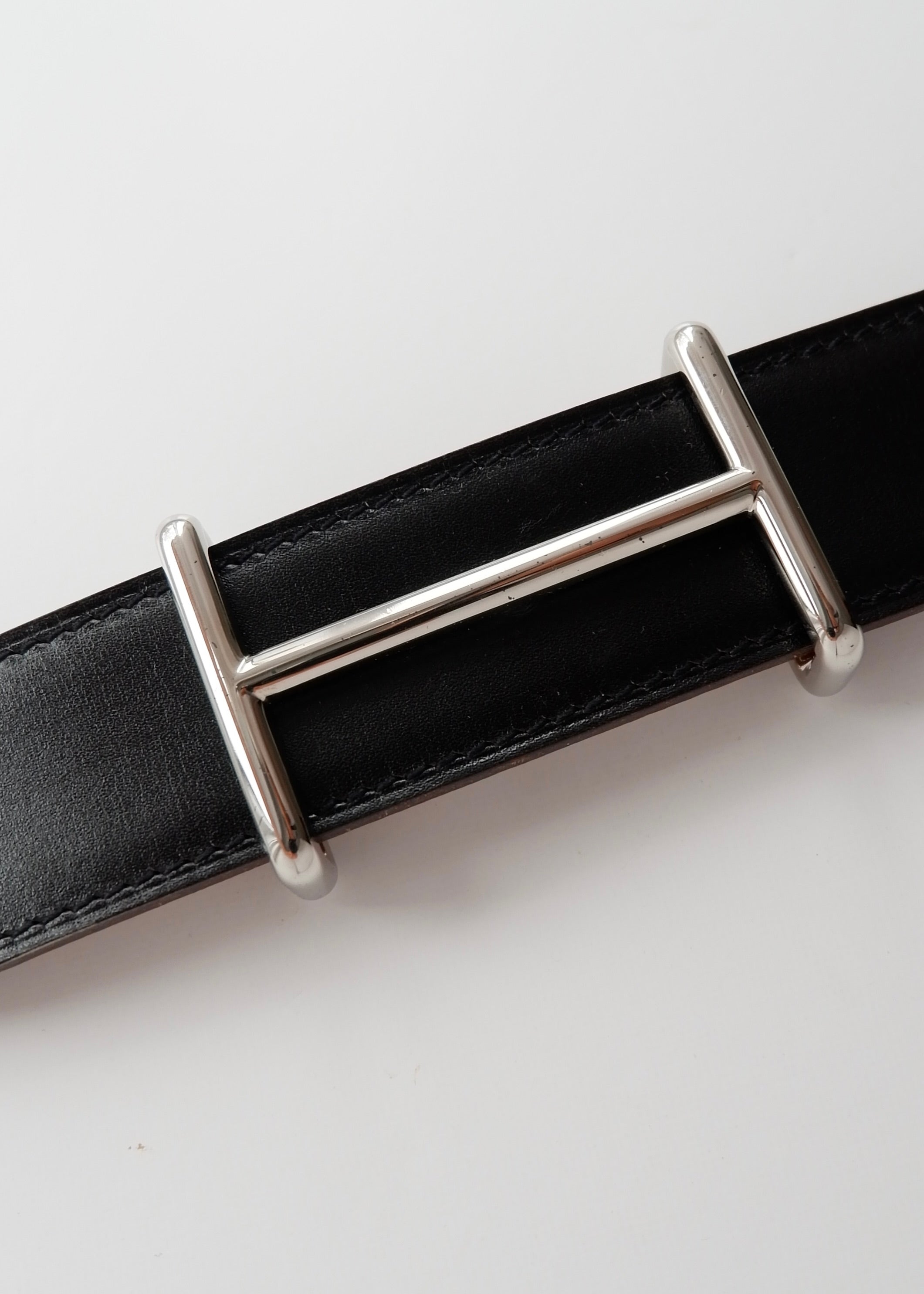 Ceinture réversible en cuir H Hermès noire/marron authentique d'occasion - 80