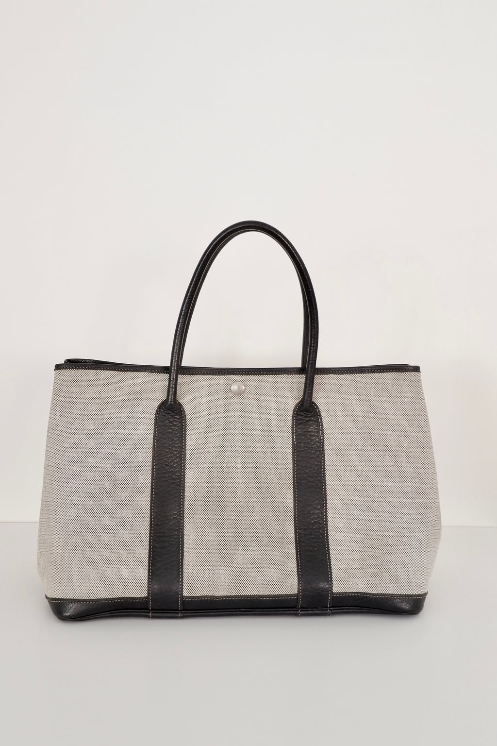 Sac cabas Hermès Garden Party authentique d'occasion en cuir et toile noirs/gris