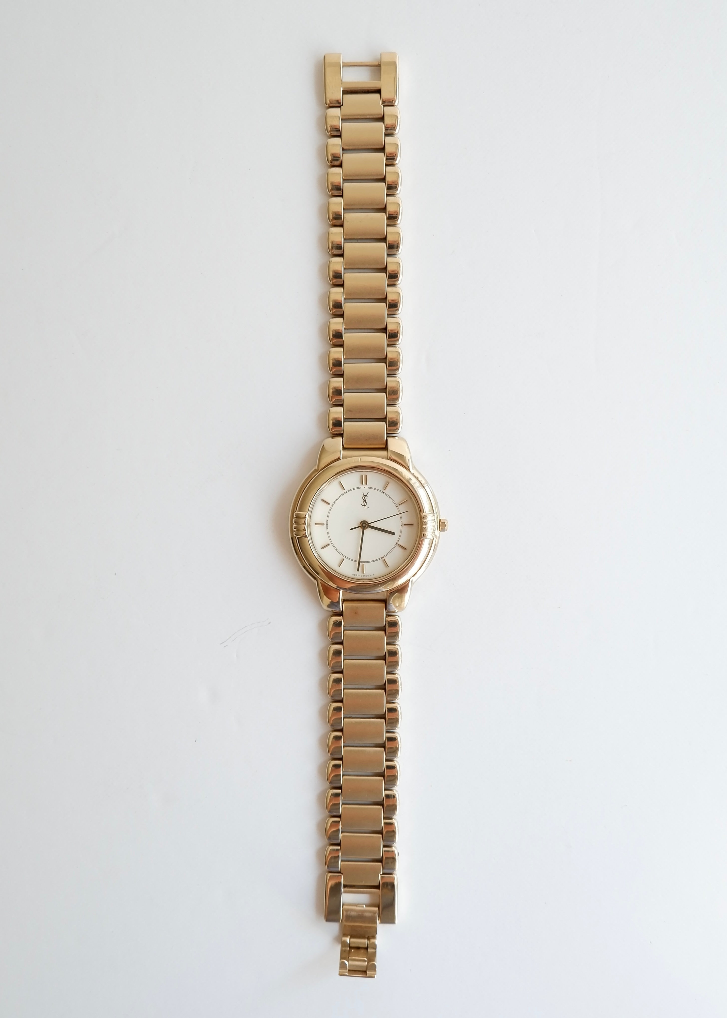 Montre vintage YSL authentique d'occasion, ton doré