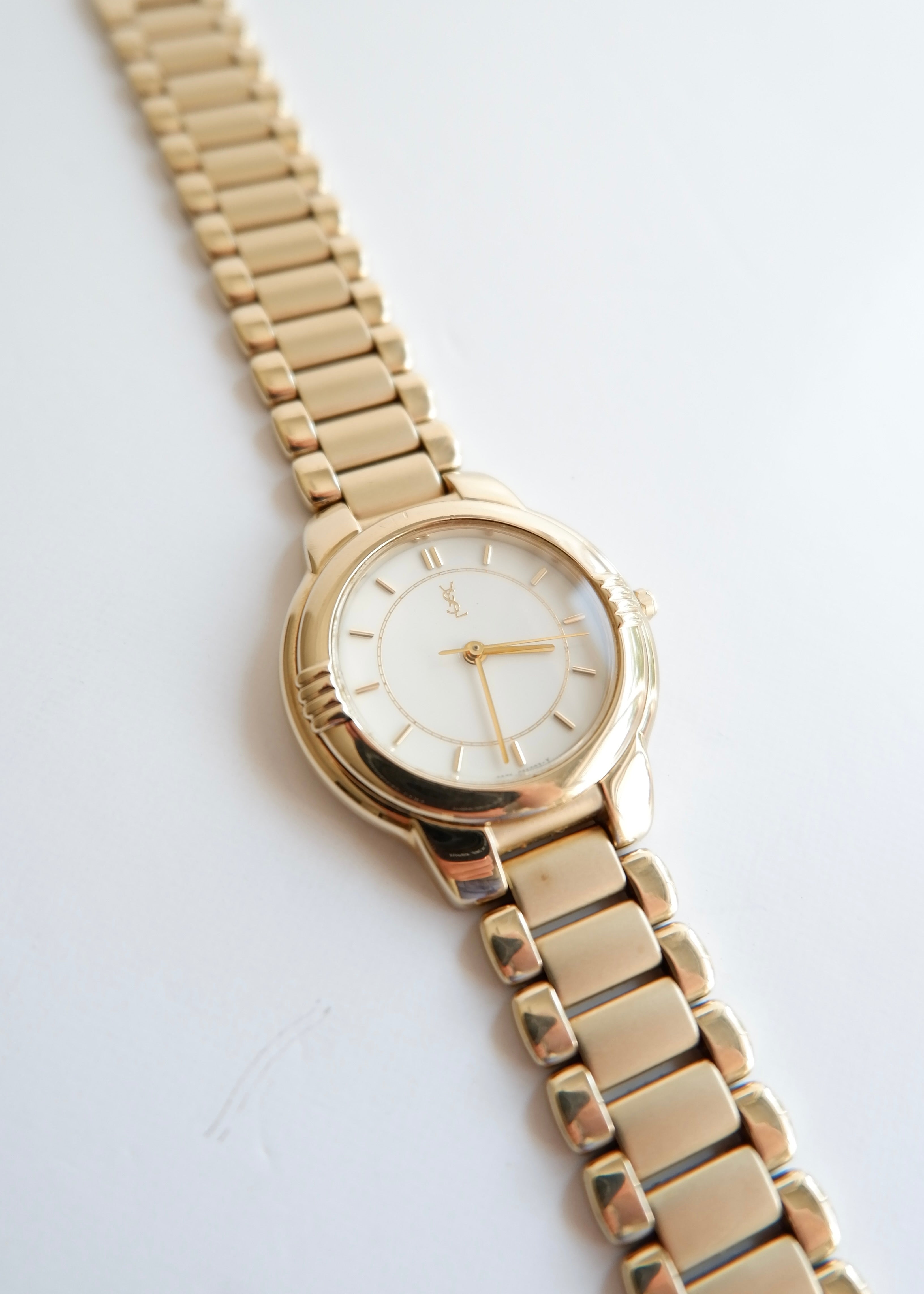Montre vintage YSL authentique d'occasion, ton doré