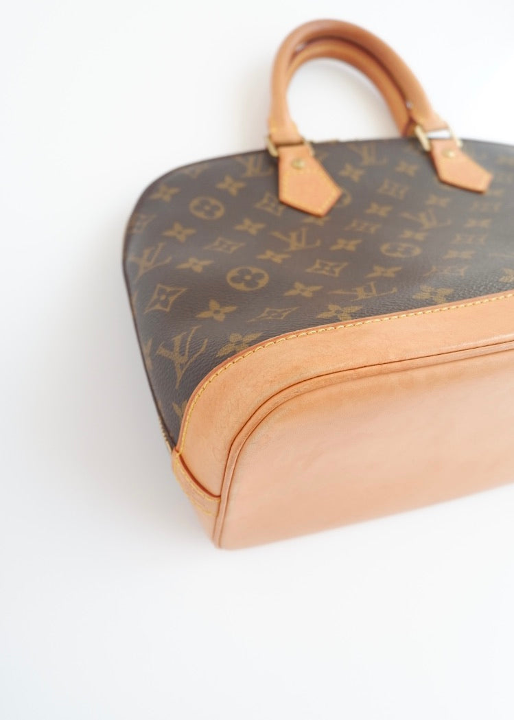 Sac à main Louis Vuitton Alma Monogram d'occasion authentique