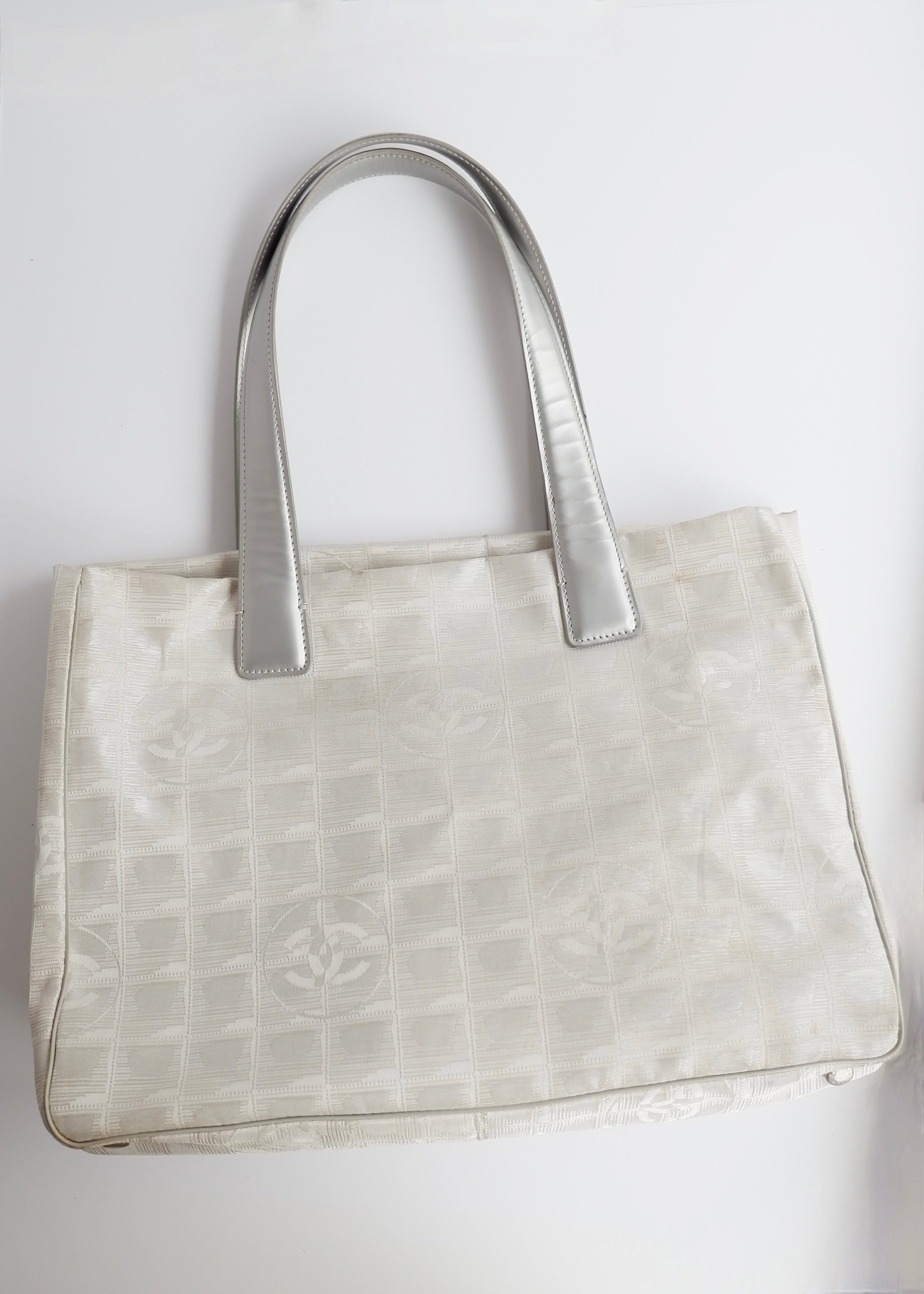 Authentic Preowned Chanel Silver Canvas New Travel Line Tote Bag