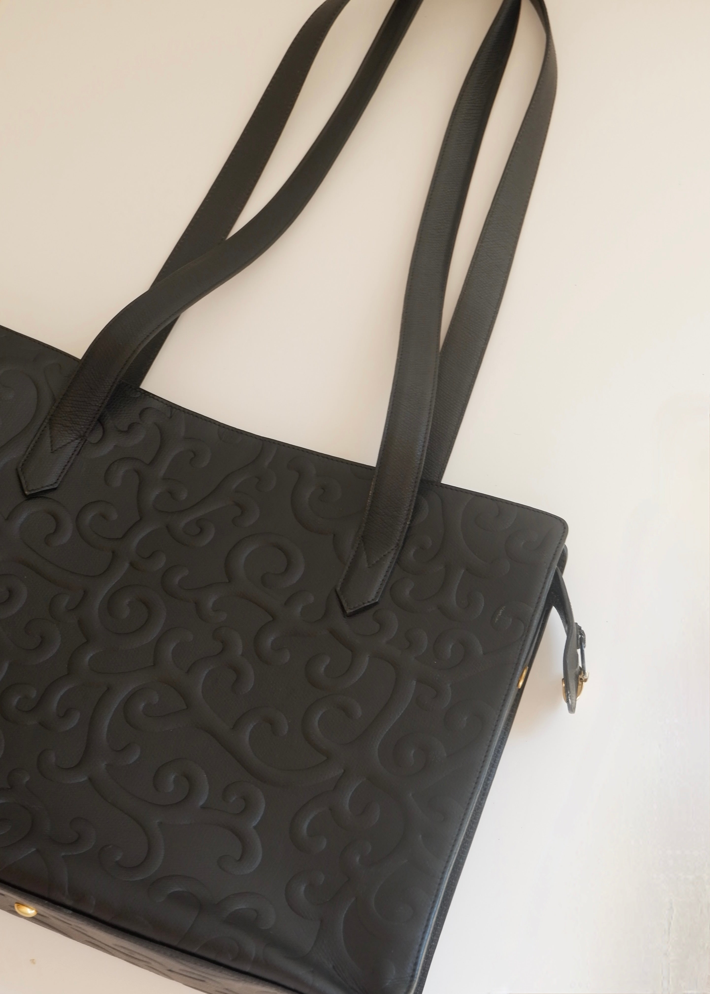 Preowned Vintage YSL Black Leather Embossed Printed Tote Bag