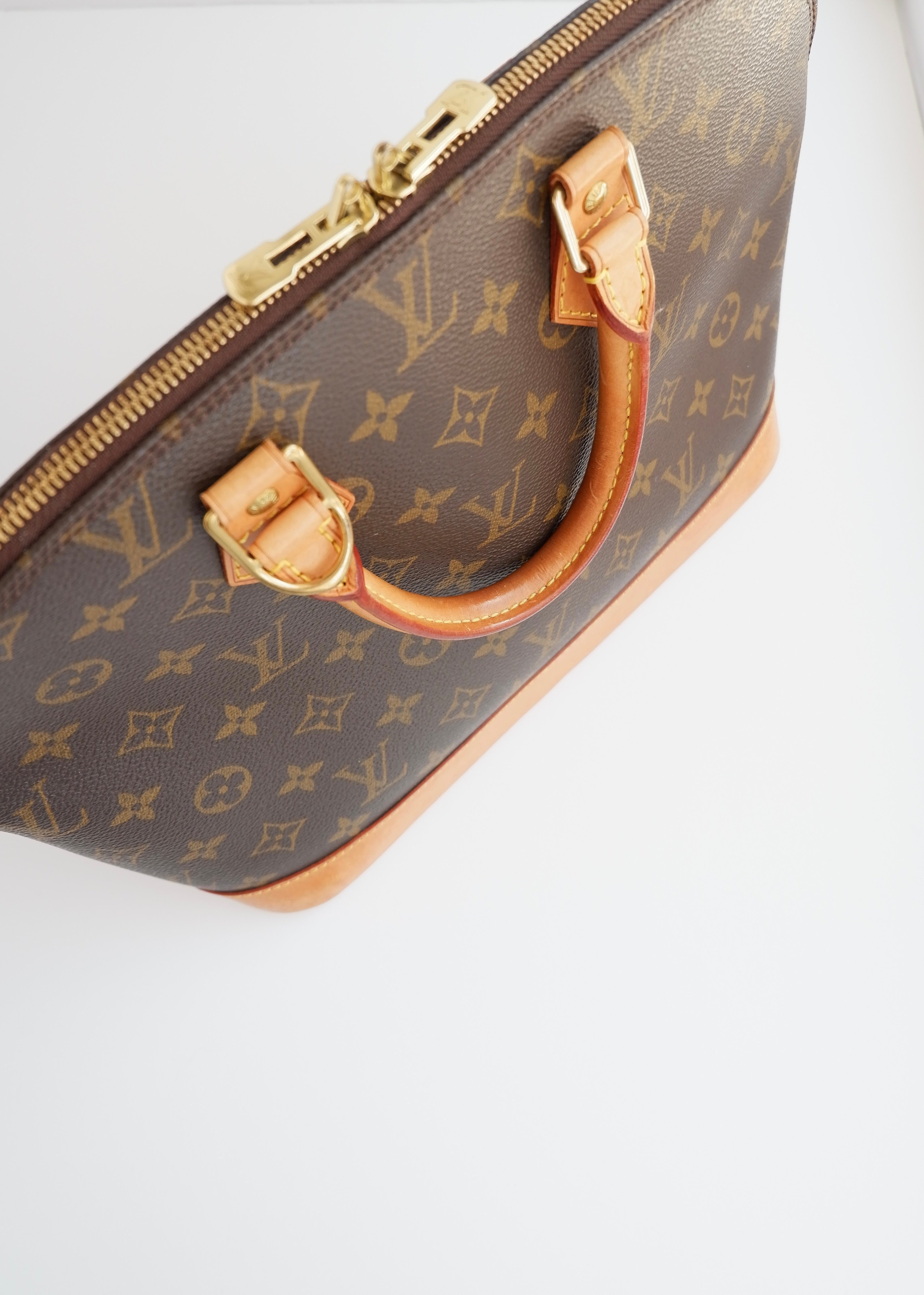 Sac à main Louis Vuitton Alma Monogram d'occasion authentique