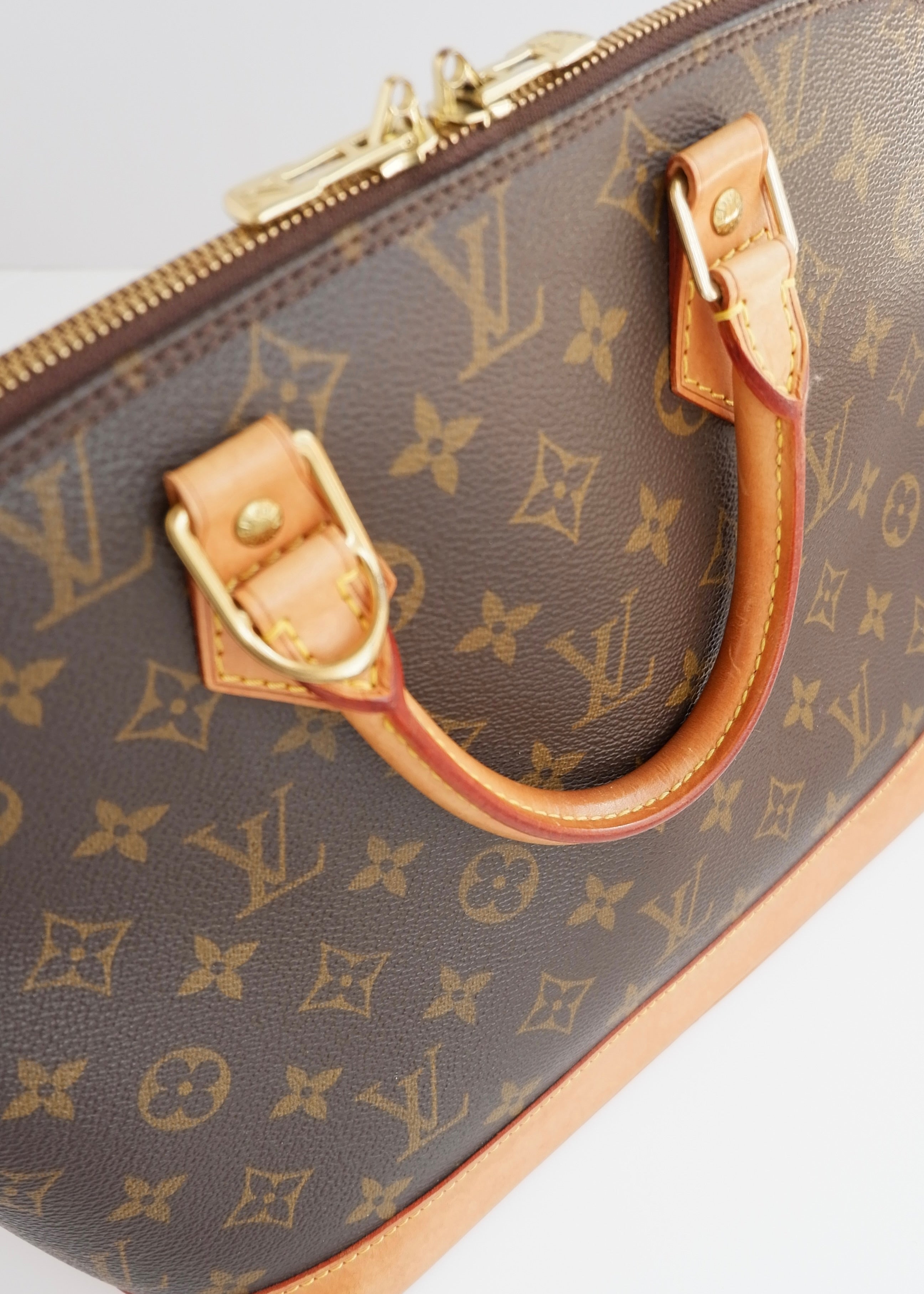 Sac à main Louis Vuitton Alma Monogram d'occasion authentique