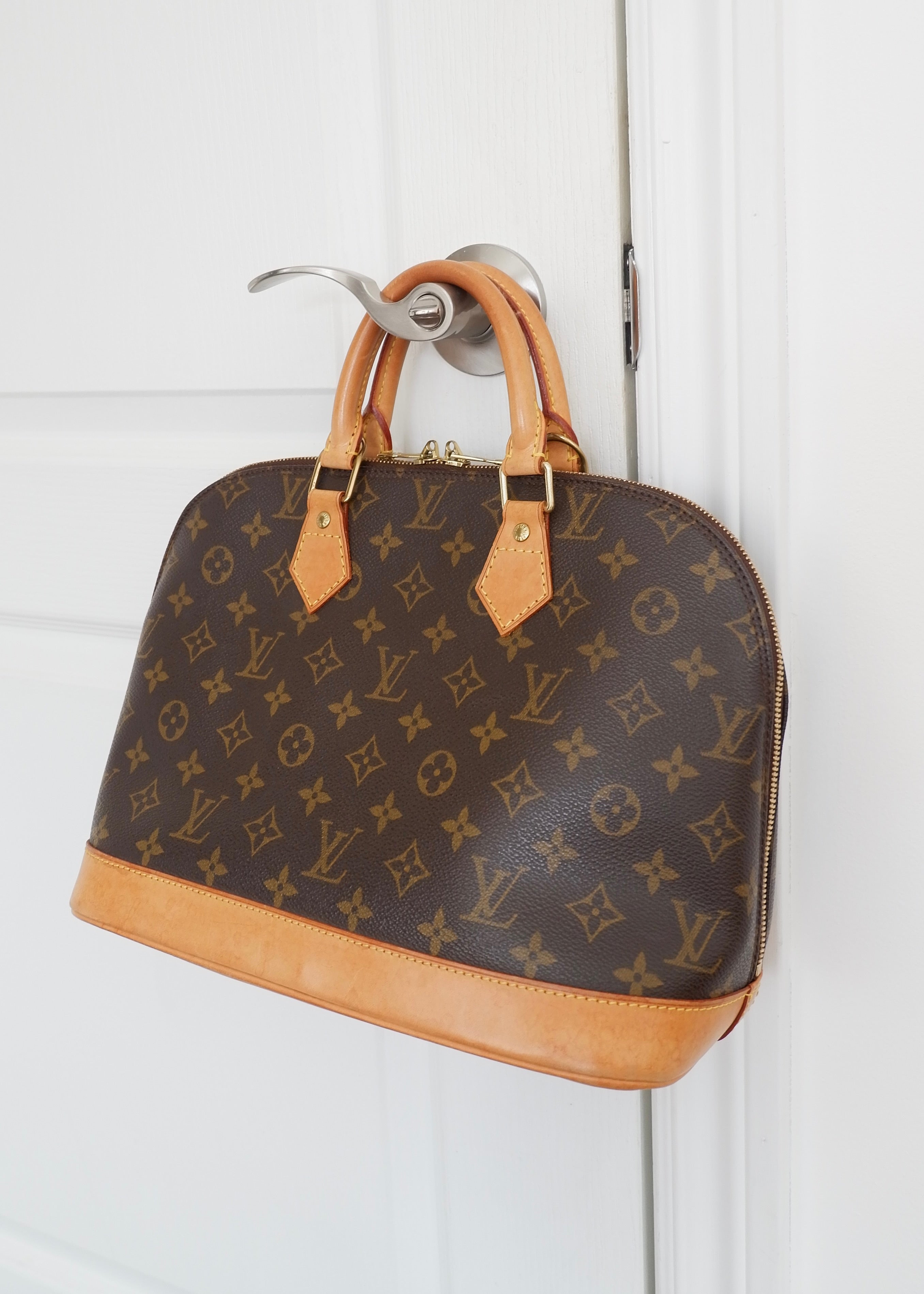 Sac à main Louis Vuitton Alma Monogram d'occasion authentique