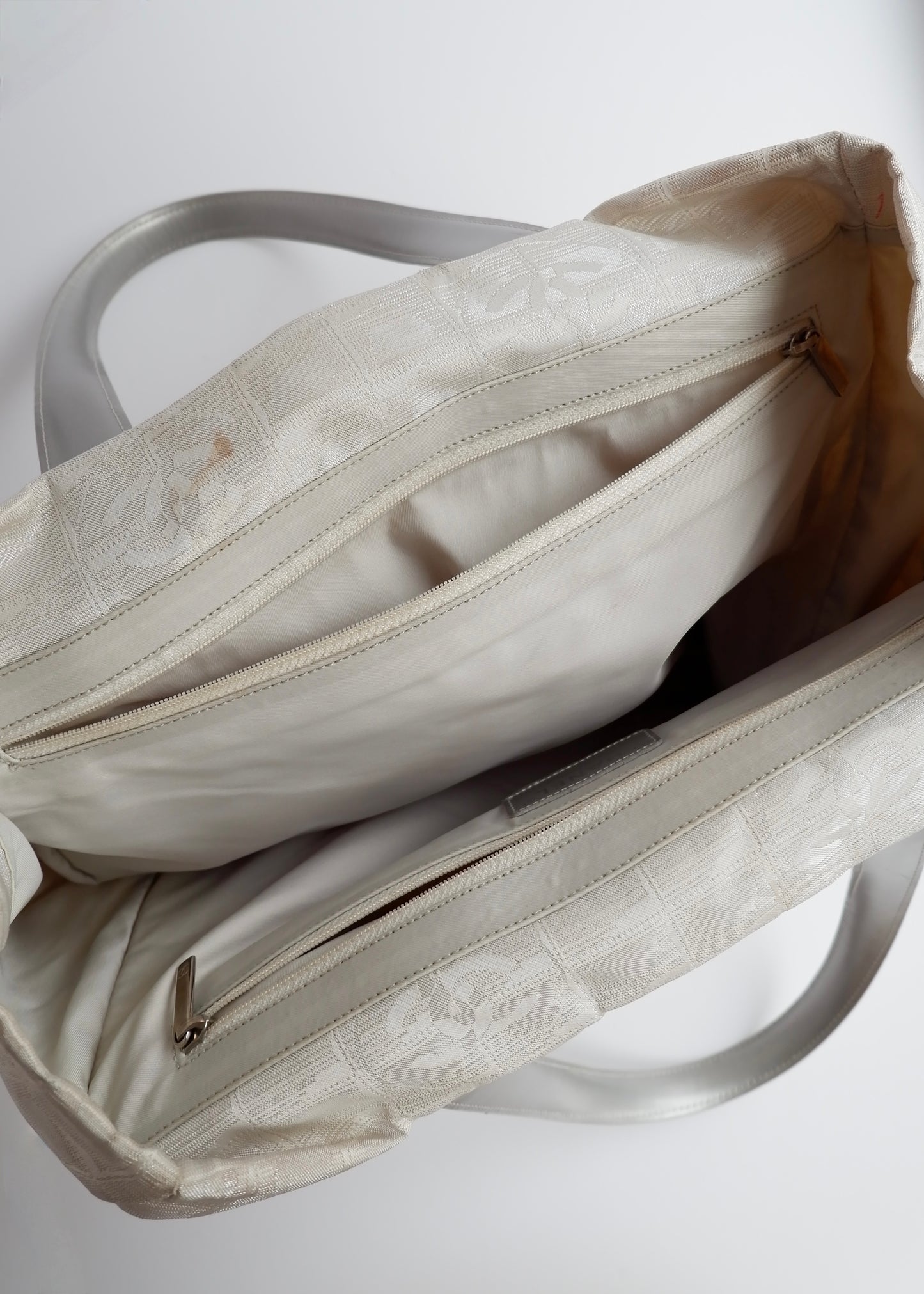 Authentic Preowned Chanel Silver Canvas New Travel Line Tote Bag