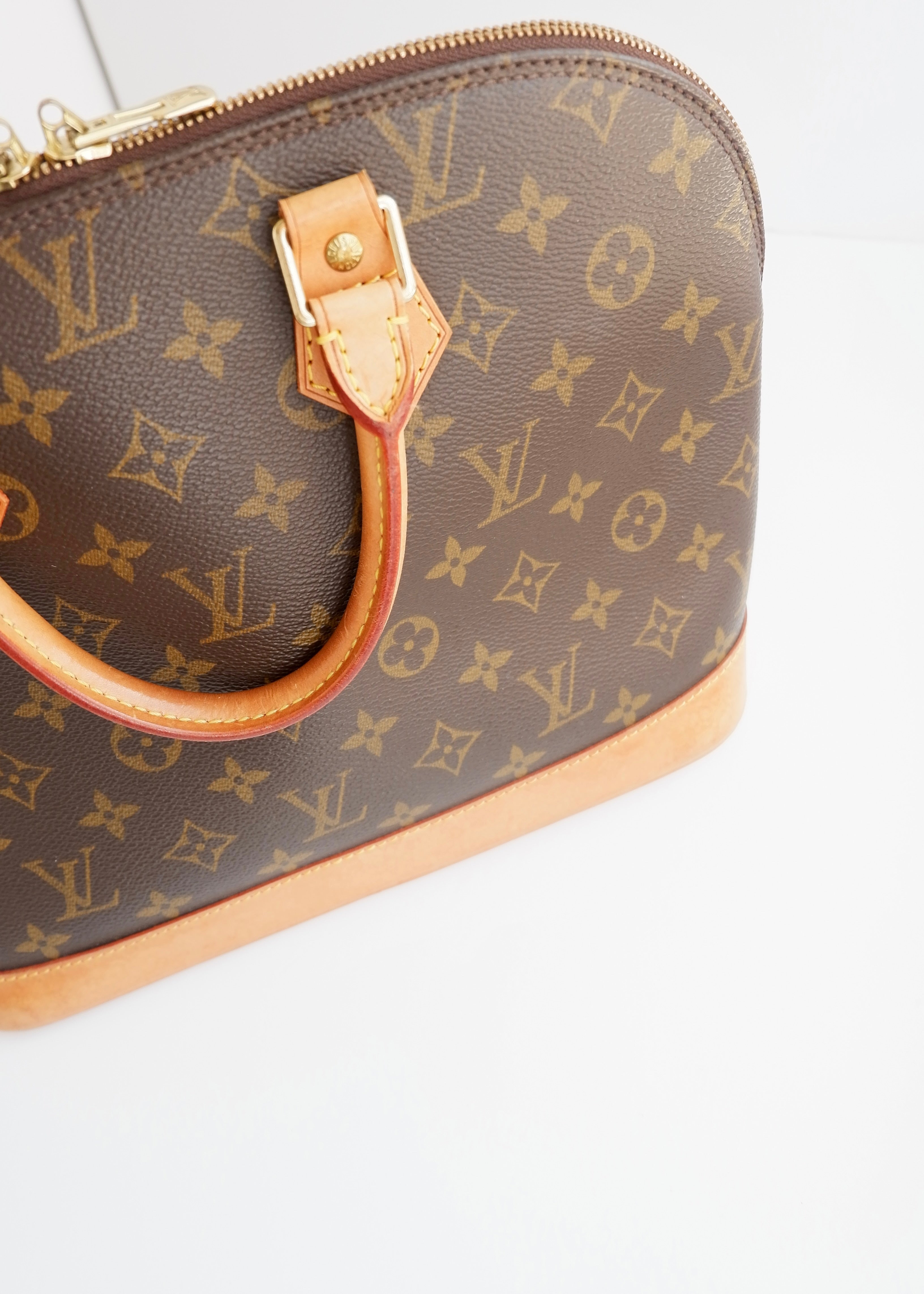 Sac à main Louis Vuitton Alma Monogram d'occasion authentique