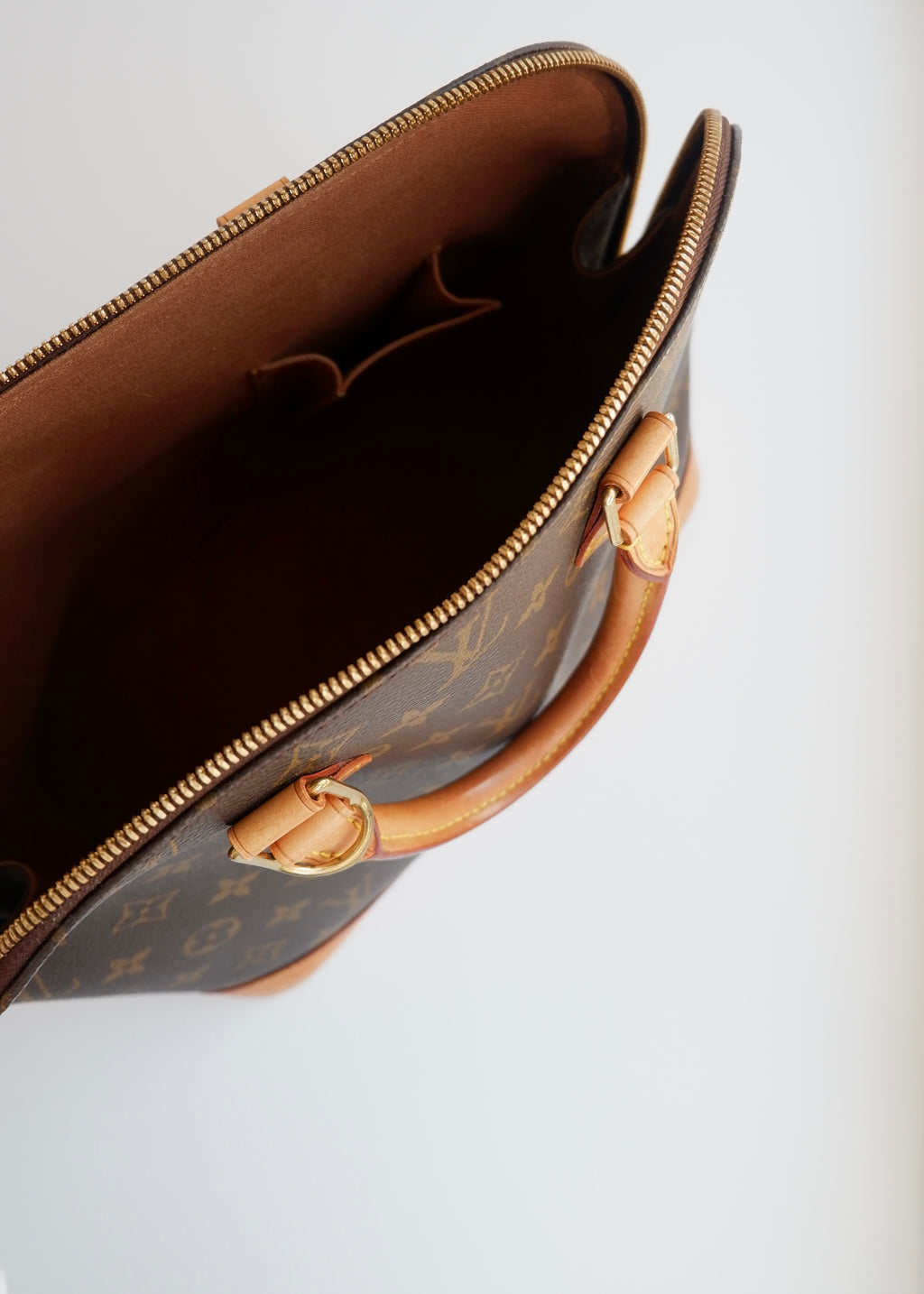 Sac à main Louis Vuitton Alma Monogram d'occasion authentique