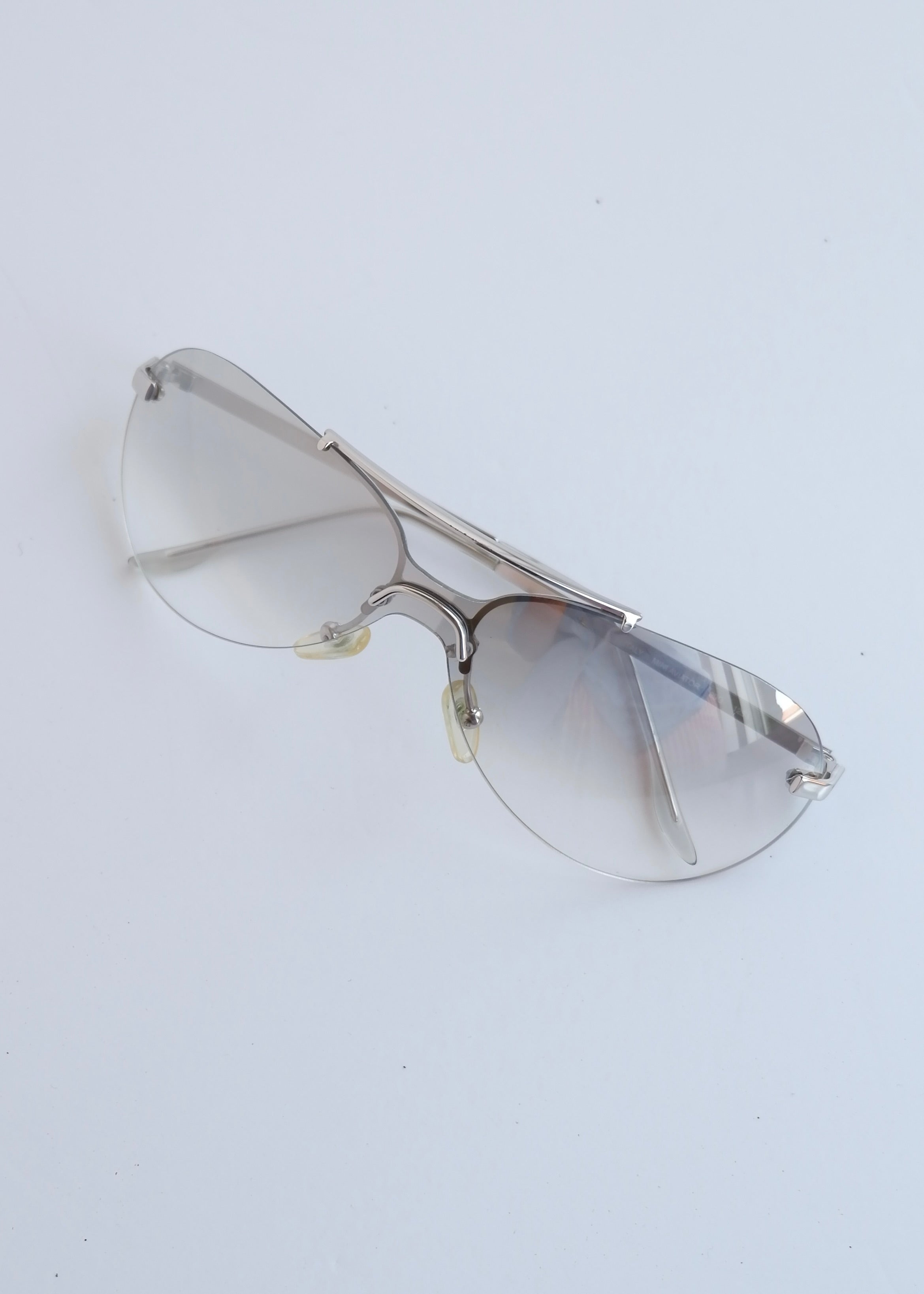 Authentiques lunettes de soleil Dior d'occasion à monture bouclier argent/transparent