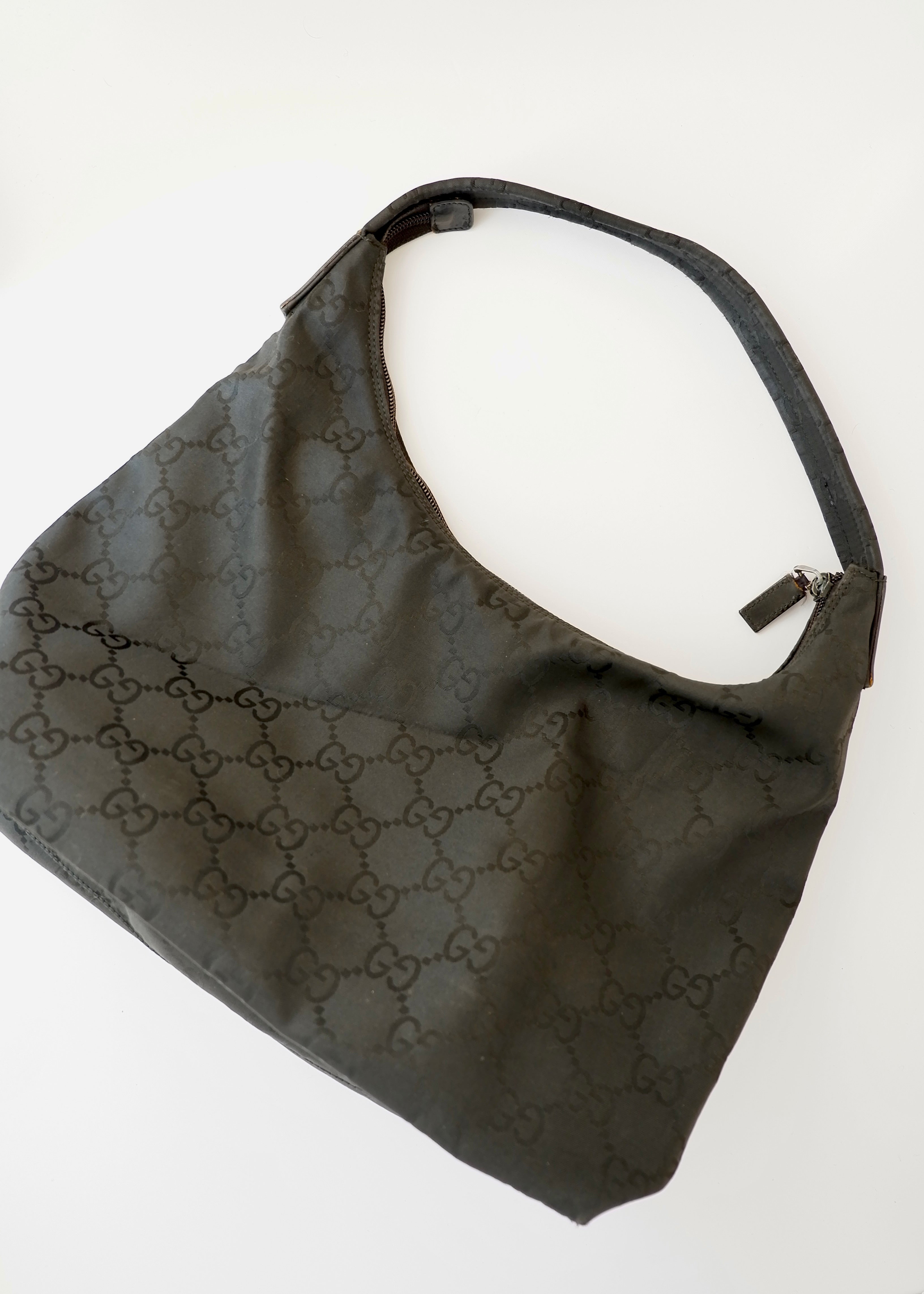 Authentique Sac à bandoulière Gucci en toile GG noire d'occasion
