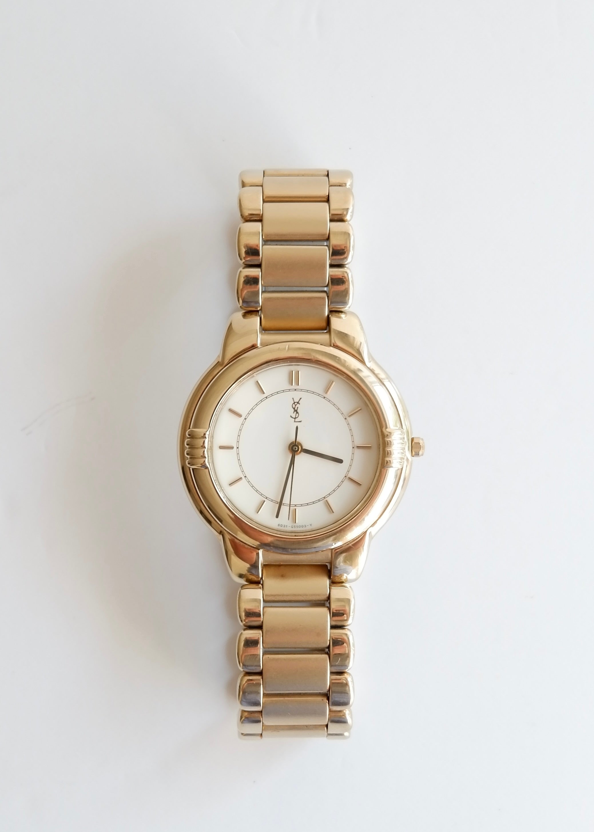 Montre vintage YSL authentique d'occasion, ton doré