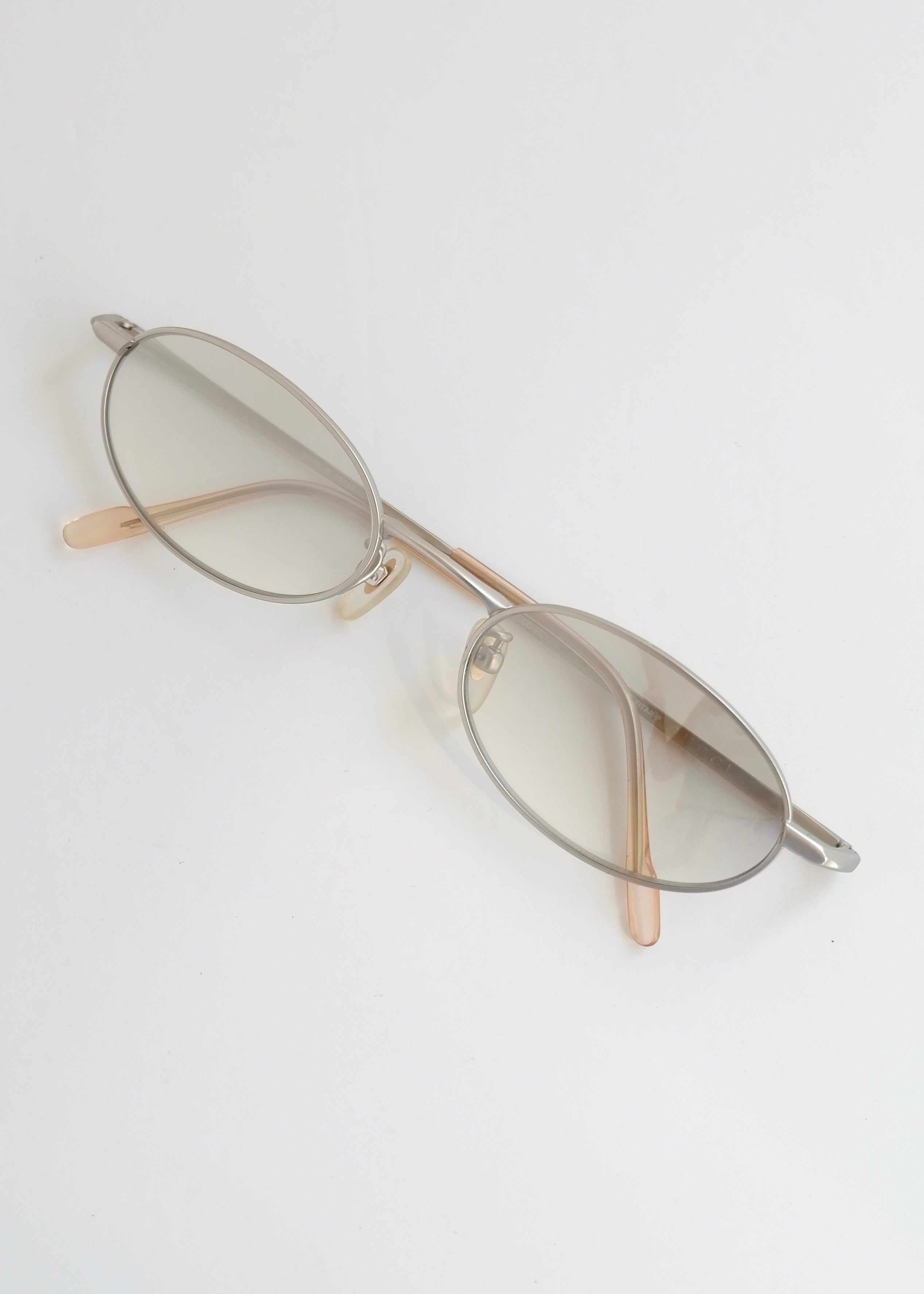 Authentiques lunettes de soleil Gucci d'occasion en argent/transparent à monture ronde