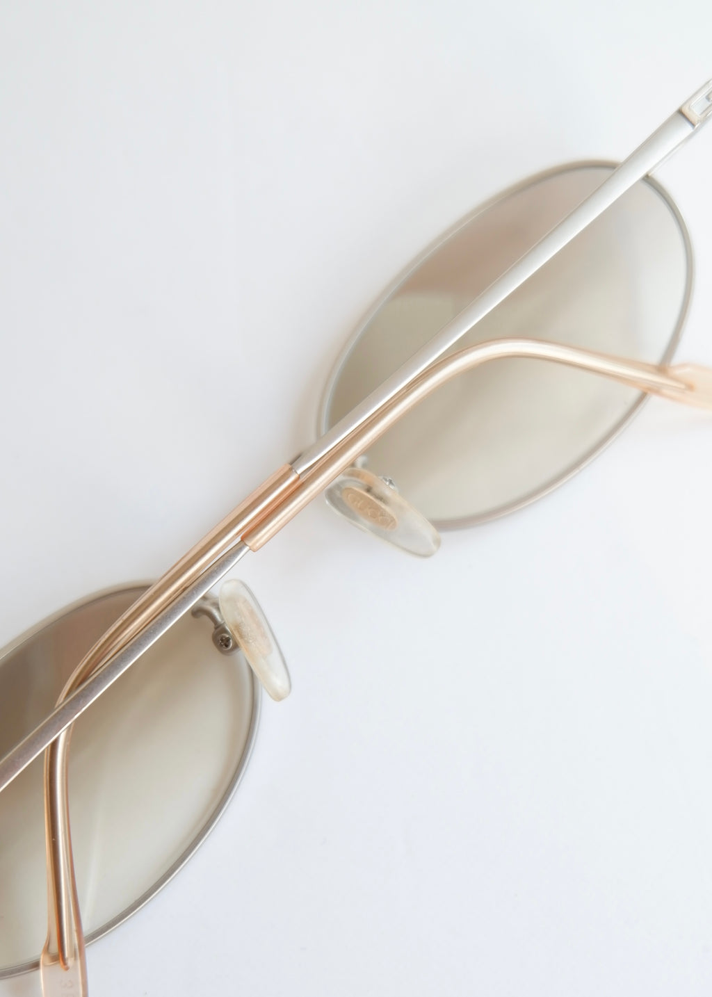 Authentiques lunettes de soleil Gucci d'occasion en argent/transparent à monture ronde