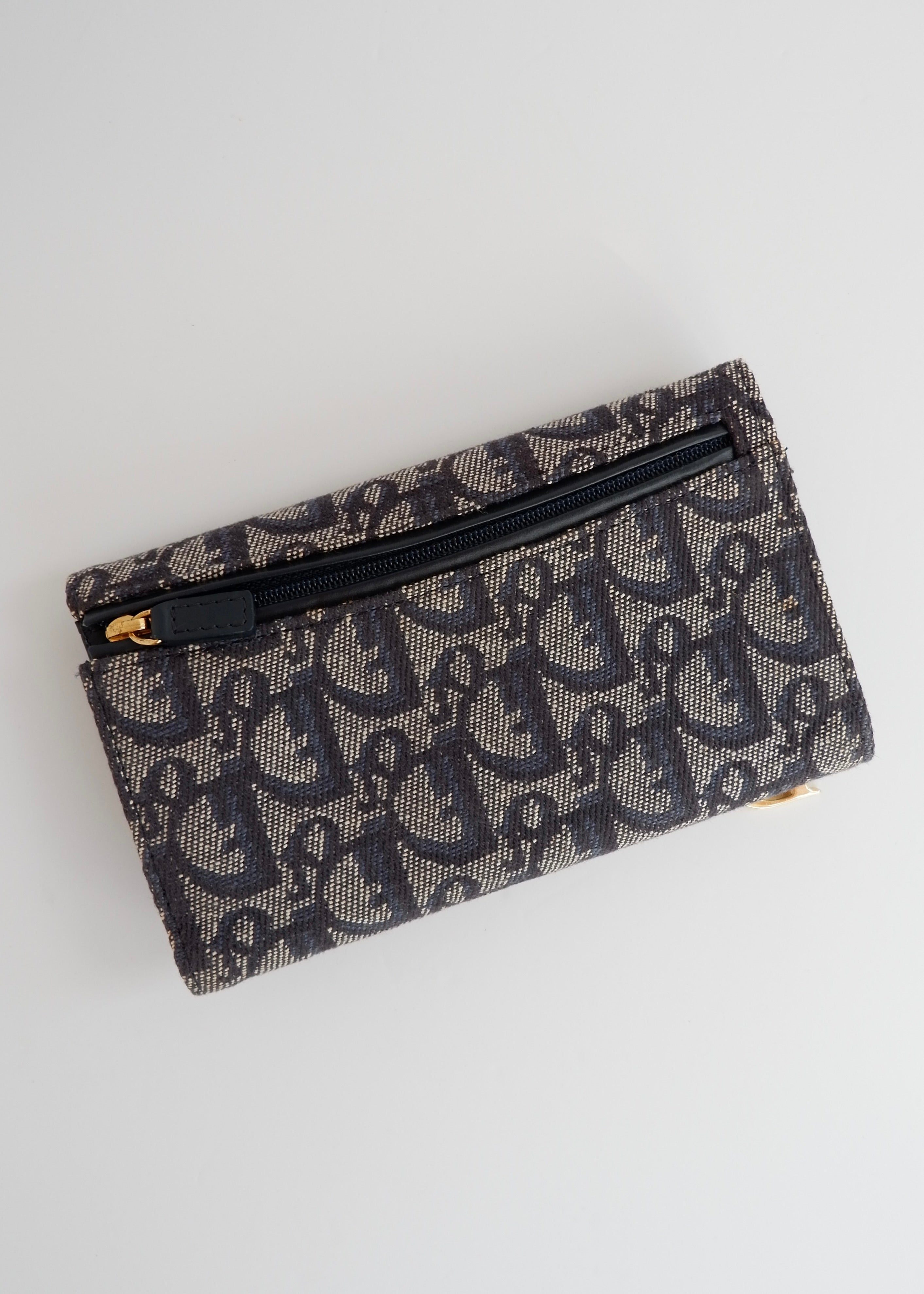 Portefeuille Dior authentique d'occasion en toile trotteur bleu marine
