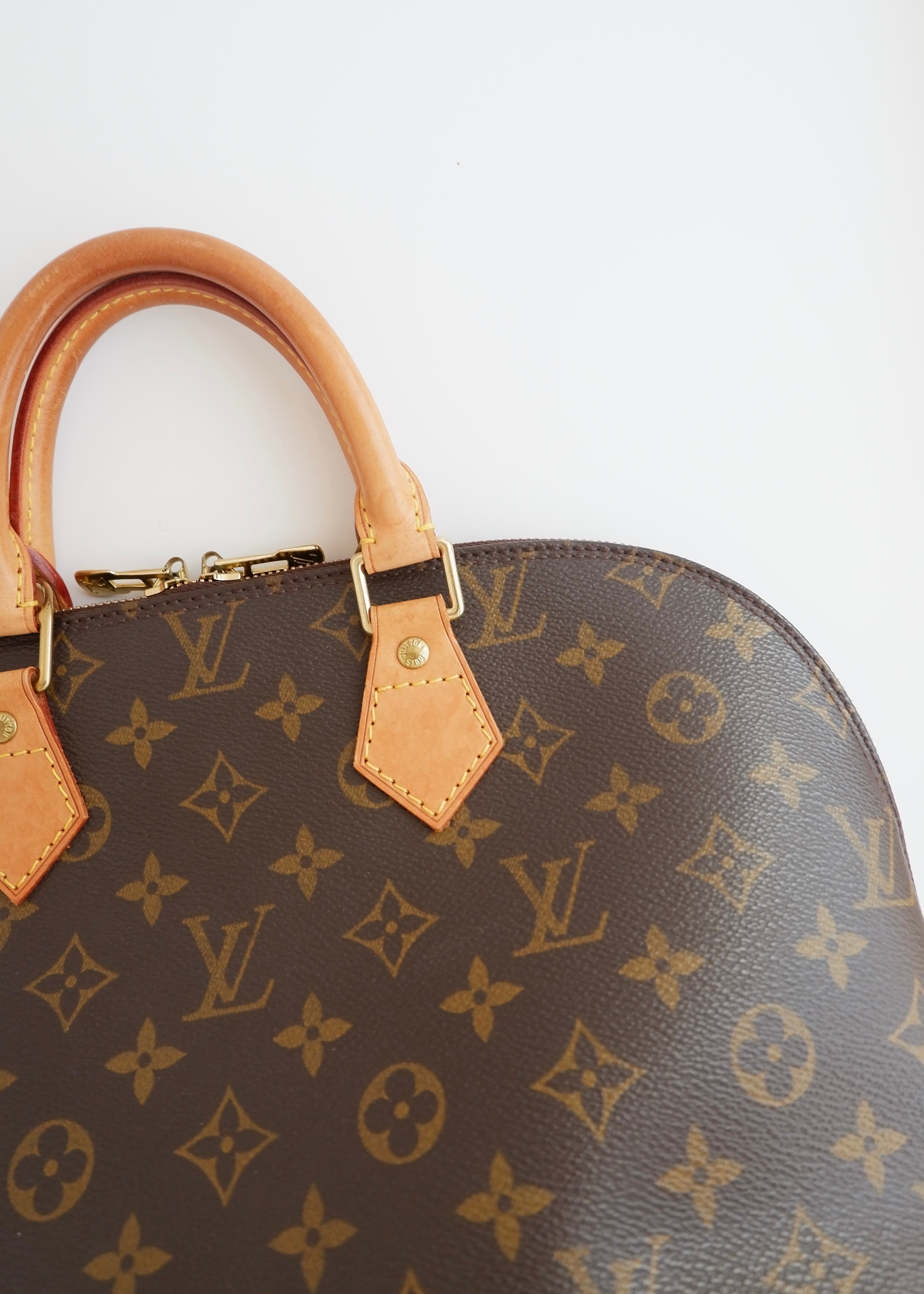 Sac à main Louis Vuitton Alma Monogram d'occasion authentique
