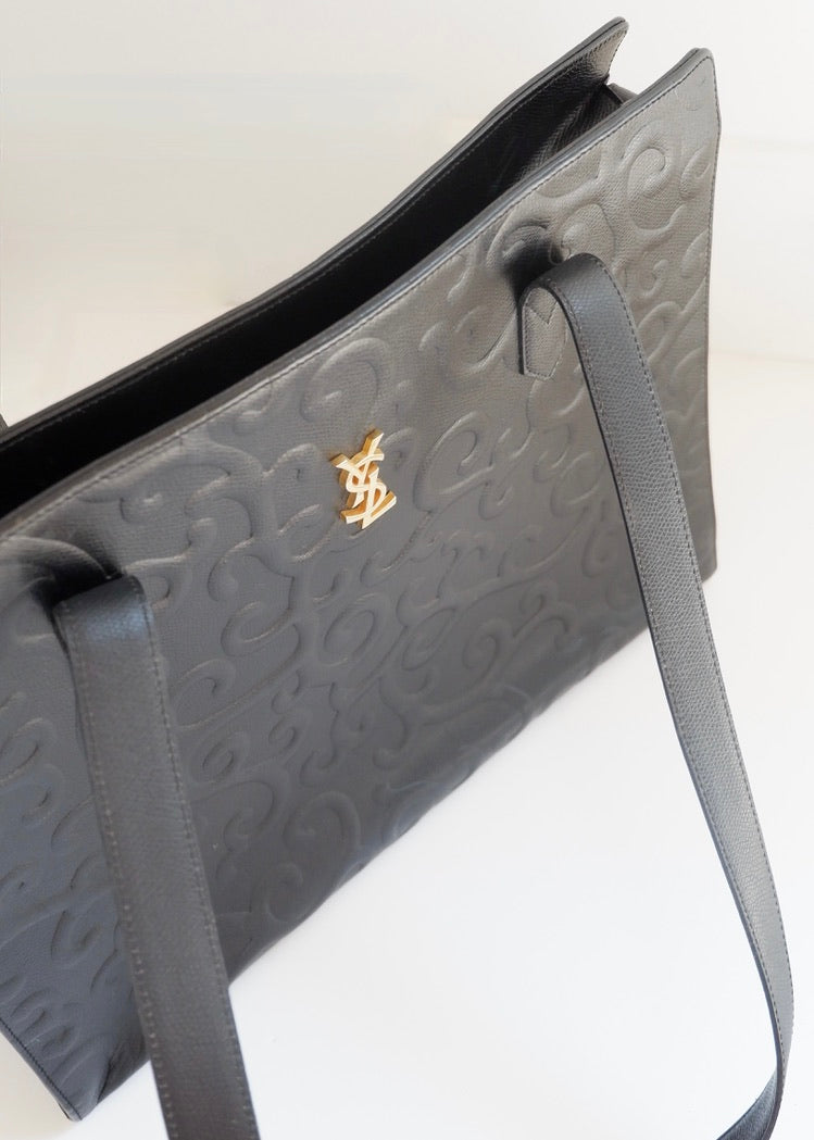 Preowned Vintage YSL Black Leather Embossed Printed Tote Bag