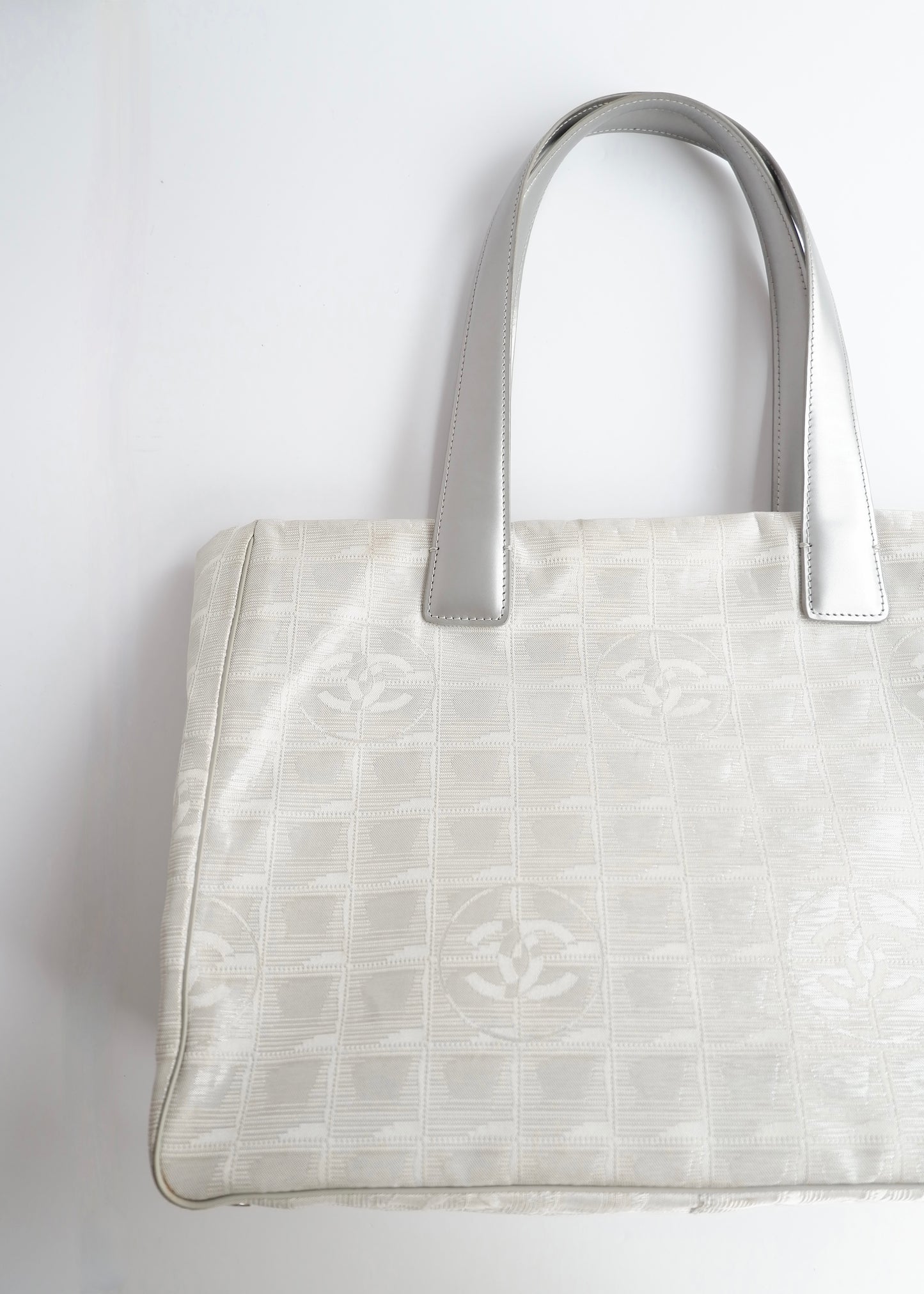 Authentic Preowned Chanel Silver Canvas New Travel Line Tote Bag