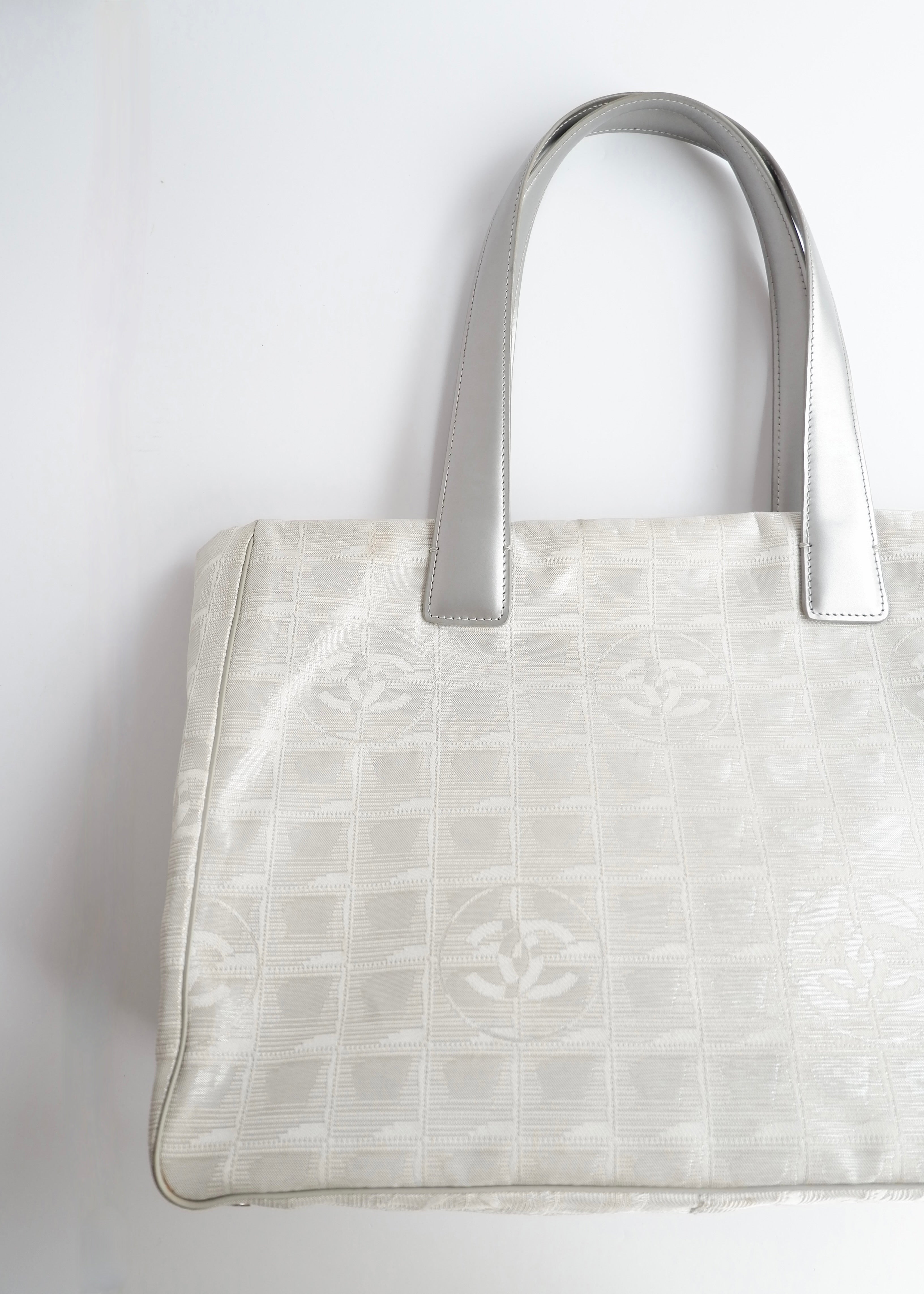 Authentic Preowned Chanel Silver Canvas New Travel Line Tote Bag