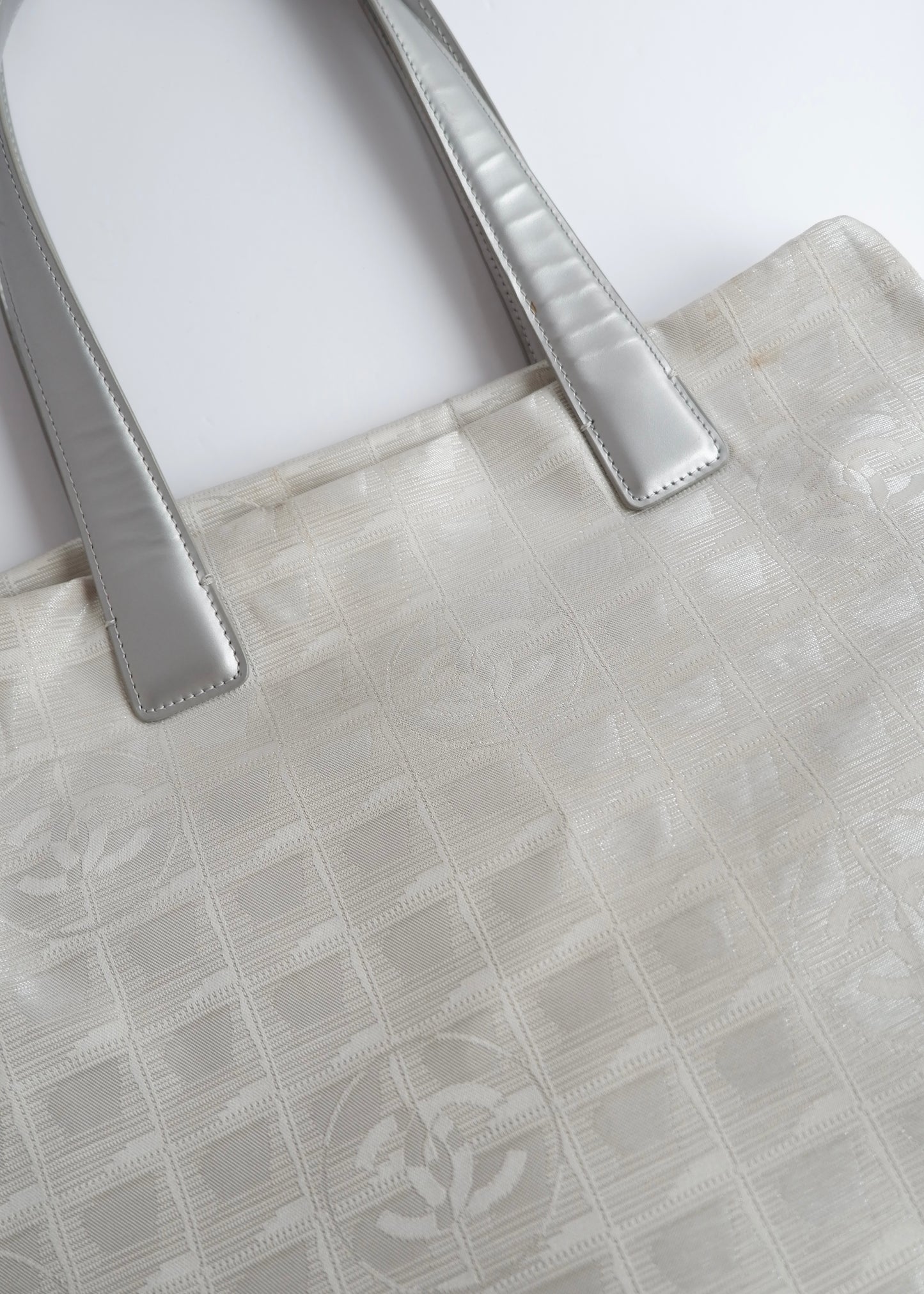 Authentic Preowned Chanel Silver Canvas New Travel Line Tote Bag