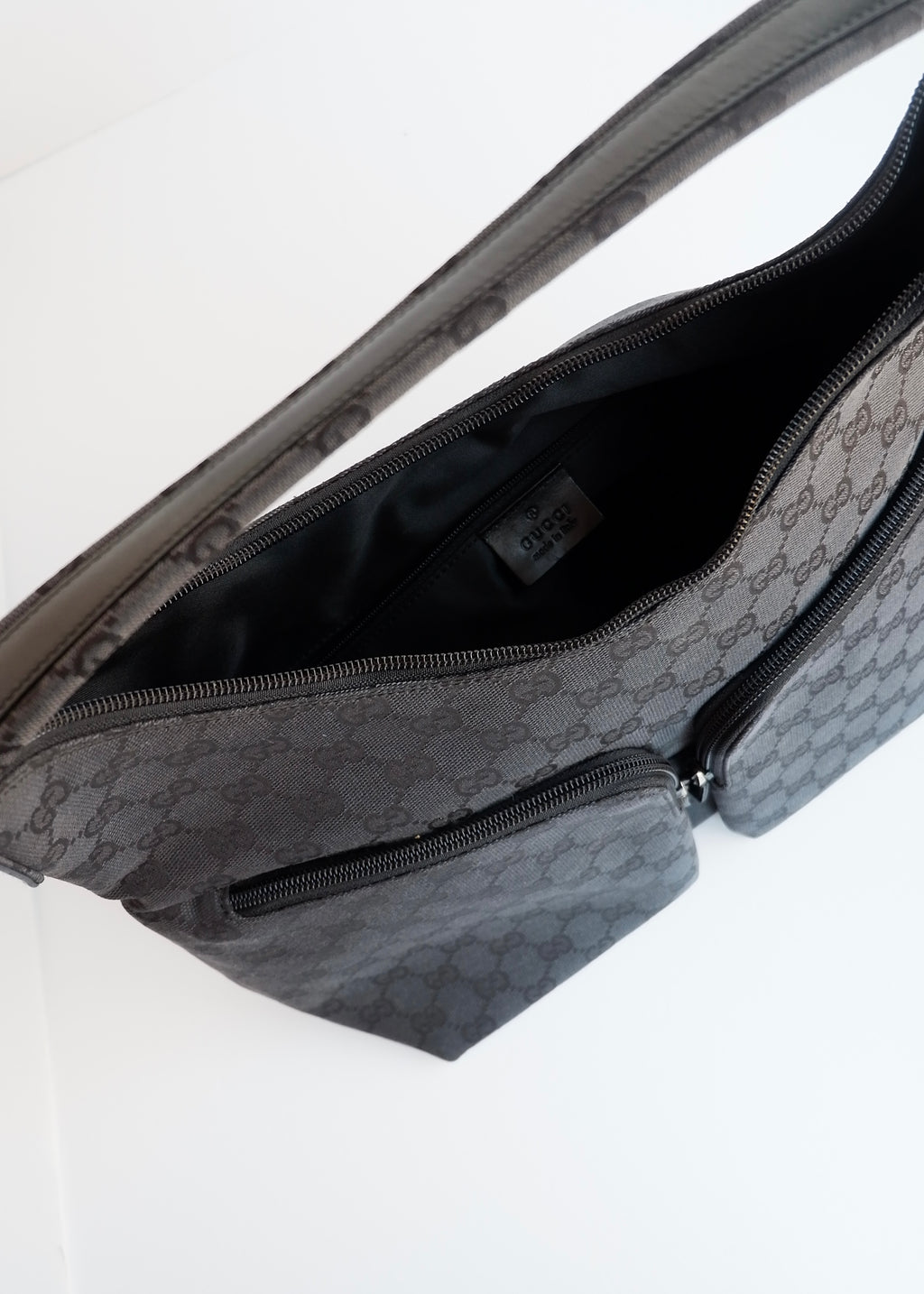 Authentique Sac à bandoulière Gucci en toile GG noire d'occasion
