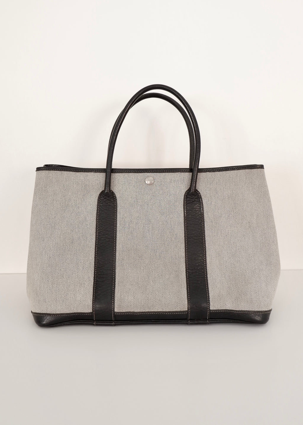 Sac cabas Hermès Garden Party authentique d'occasion en cuir et toile noirs/gris