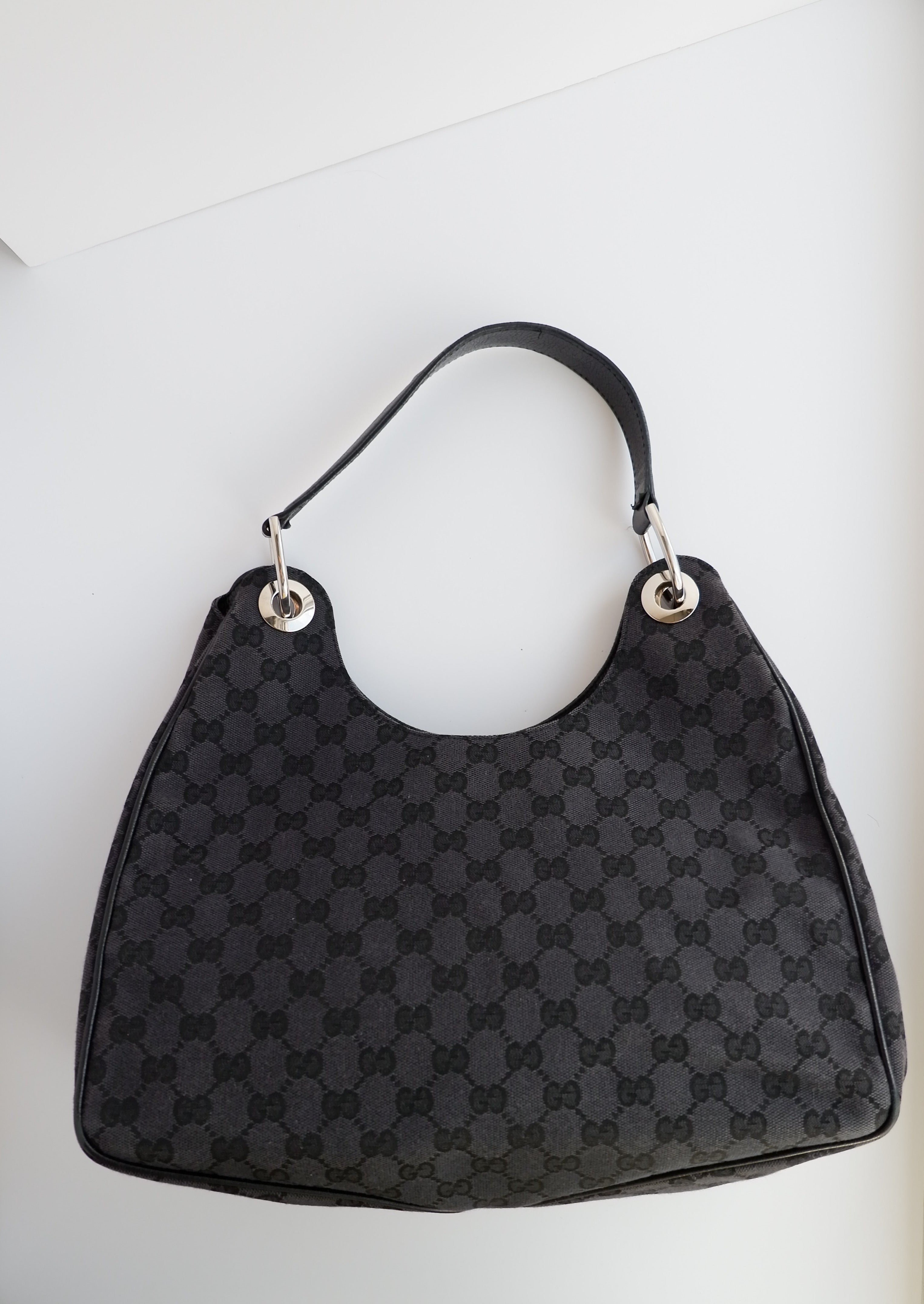Authentique Sac à bandoulière Gucci en toile GG noire d'occasion